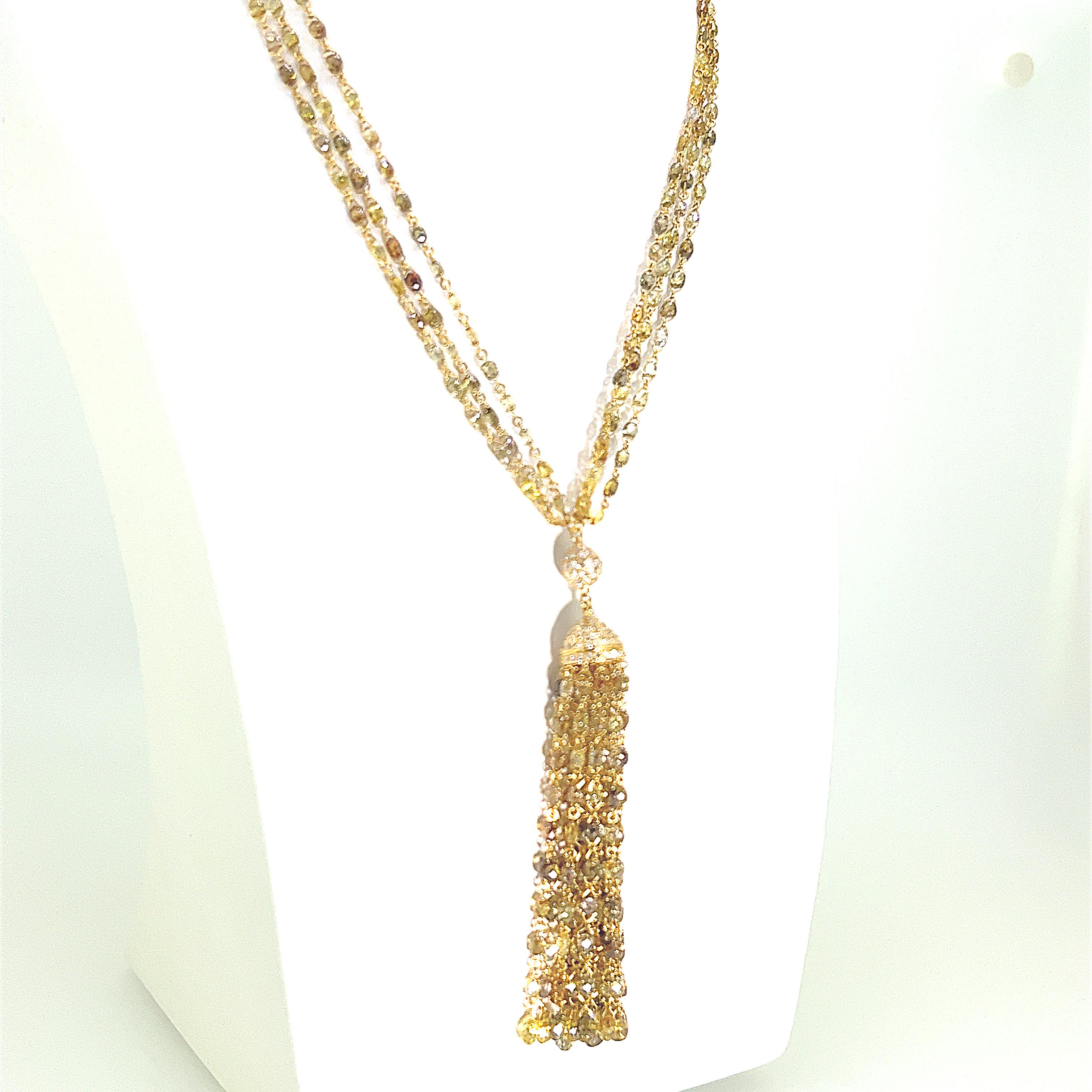 This is a timeless piece of tassel necklace inspired by the 1920 style.   It features 959 pieces of Briolette cut and Round Brilliant cut Yellow Diamonds set on 18 Karat Yellow Gold with a 7cm tassel pendant weighing 59.66 carats in total.  