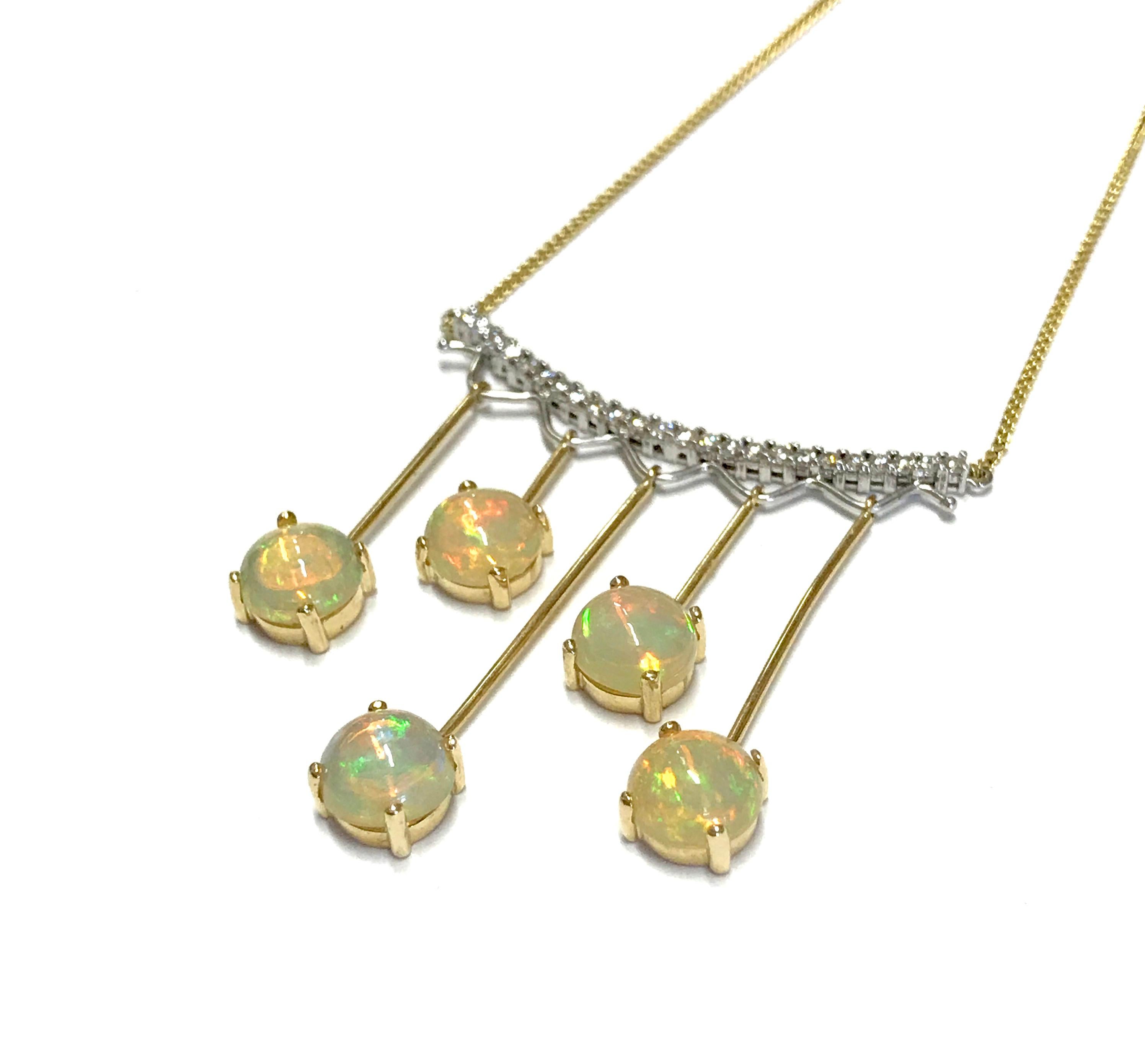 Material: 14k Yellow Gold 
Center Stone Details: 5 Round Opals at 5.97 carats
Mounting Stone Details: 24 Brilliant Round White Diamonds at 0.48 Carats - Clarity: SI / Color
Chain Length:  18 Inch

Fine one-of-a-kind craftsmanship meets incredible