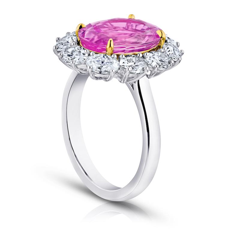 5.97 carat oval pink sapphire with oval diamonds 2.03 carats set in a platinum and 18k yellow gold ring.
