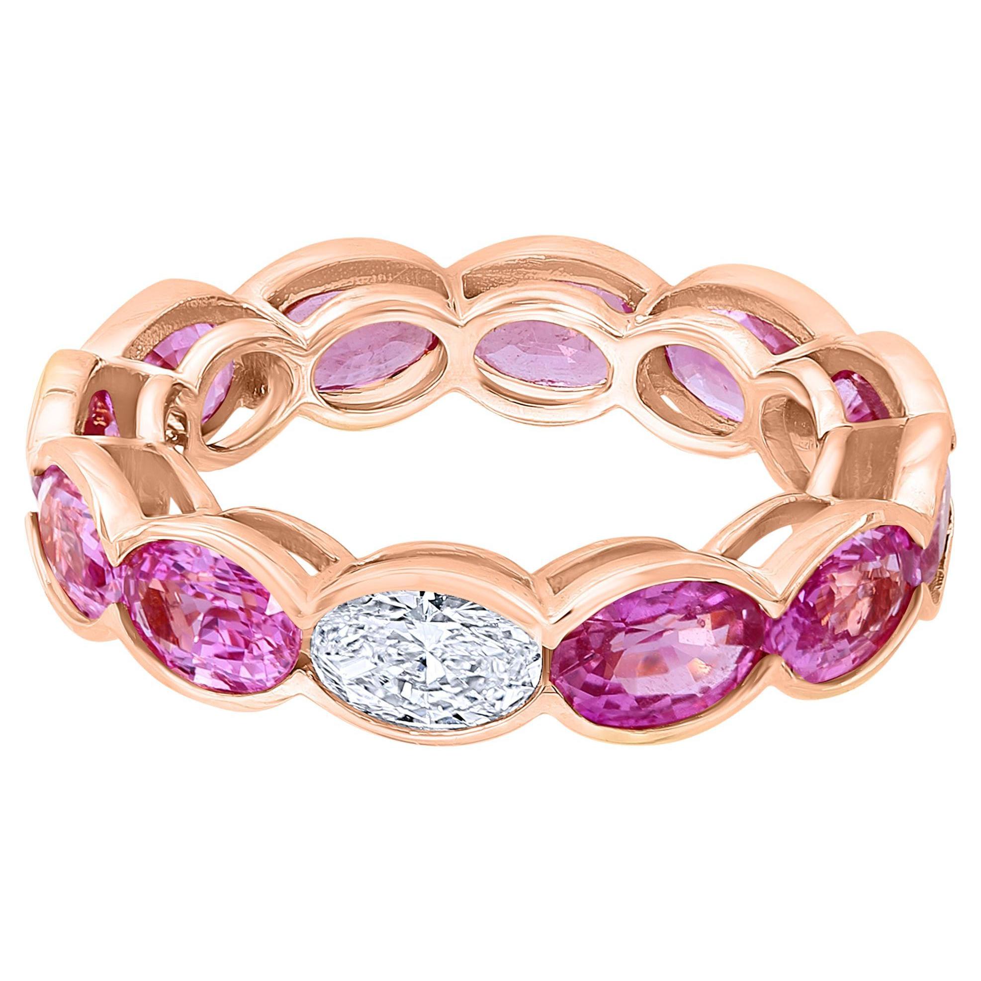 Beautiful and Forward Eternity Band.
Ring features 11 perfectly matched Pink Sapphires weighing 5.97 Carats and
1 Oval Cut Diamond weighing 0.36 Carats.
Set in 18 Karat Rose Gold.
Size 6
Can be worn Diamond Side up or down.