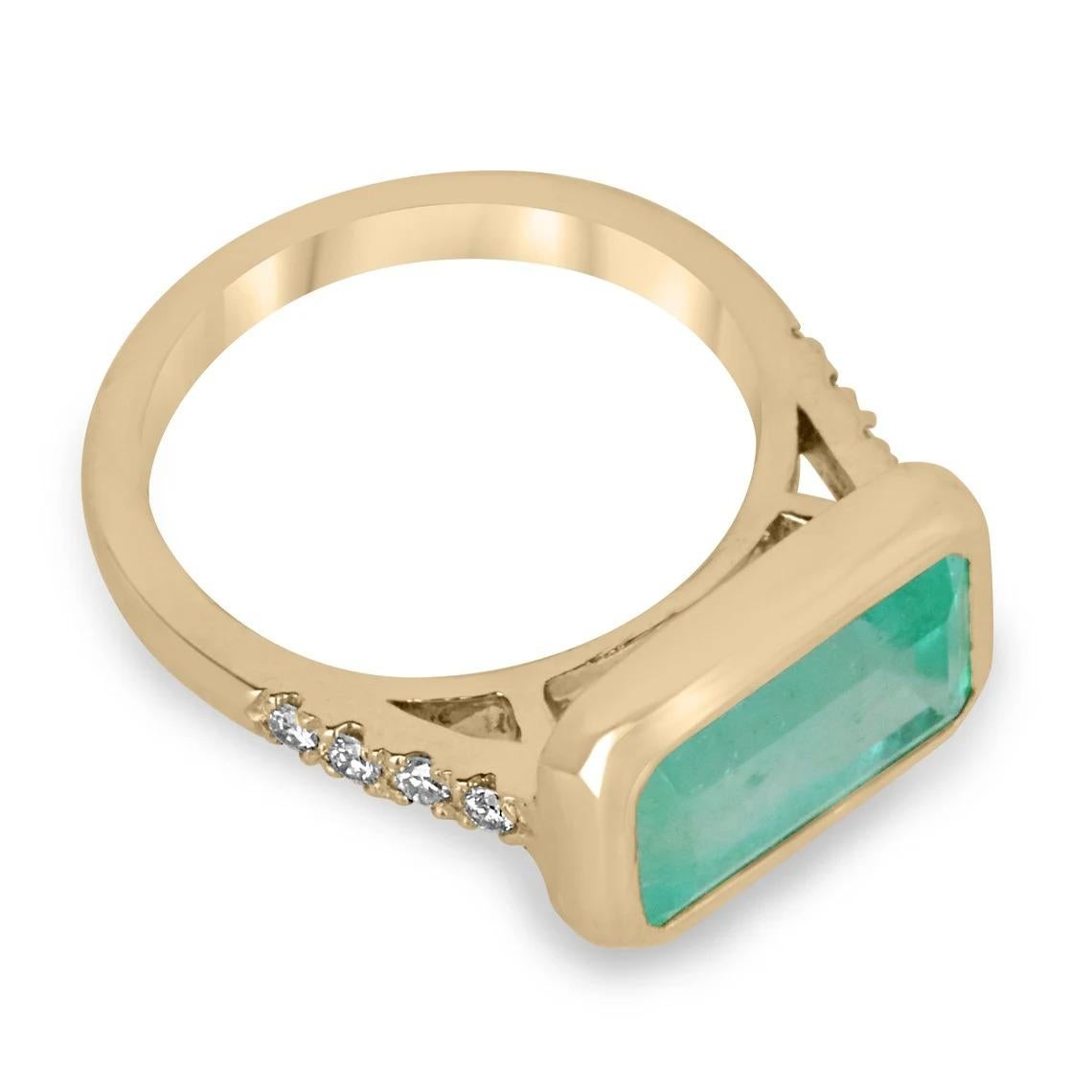 Featuring a one of a kind emerald and diamond ring. This remarkable piece features a large emerald cut emerald from the best mines in the world, Colombia. The gemstone showcases an enthralling spring green color that is vivacious and lustrous all in