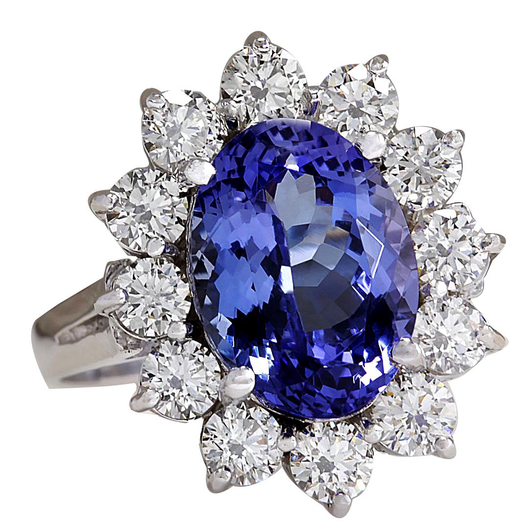 Indulge in luxury with our exquisite 14K White Gold Diamond Ring, a masterpiece crafted to captivate. This stunning ring, weighing 4.7 grams and elegantly stamped with 14K White Gold, showcases a mesmerizing 5.98 Carat Tanzanite at its heart,