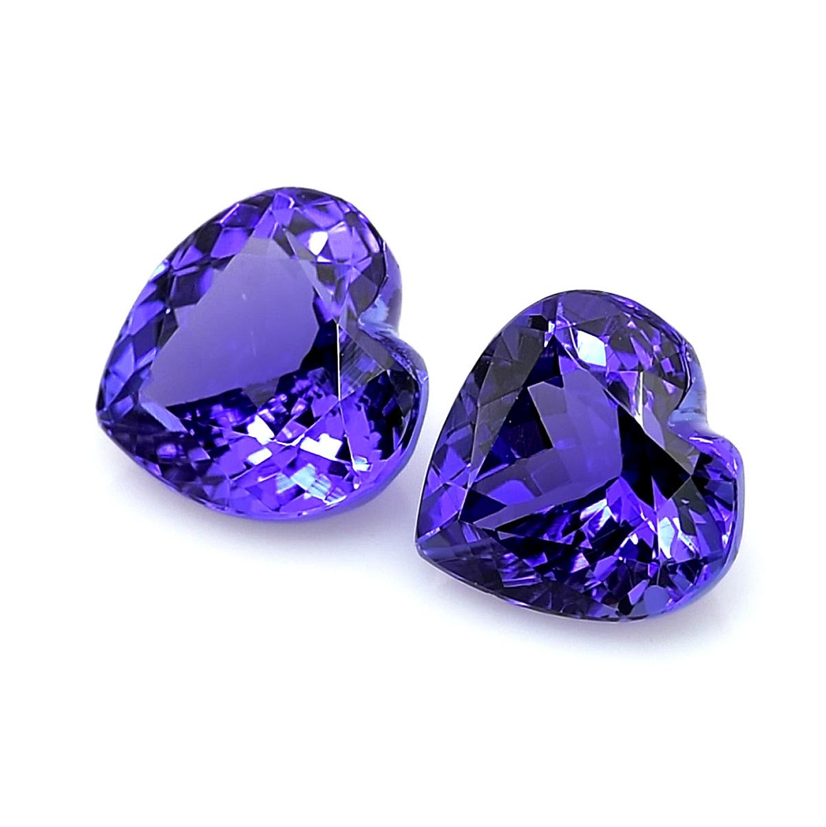 A deep purplish blue beams from this pair of natural Tanzanites. The perfect pair of hearts, their well-matched shape and color will add the right pop to that custom pair of earrings.

Identification: Natural Tanzanites Pair

• Carat: 5.99 carats