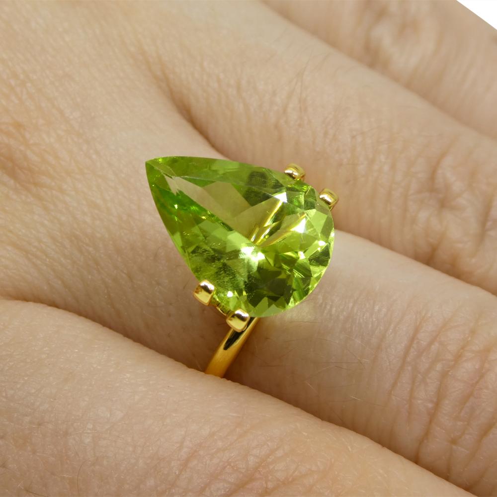 Description:

Gem Type: Peridot
Number of Stones: 1
Weight: 5.9 cts
Measurements: 14.80 x 10.49 x 6.53 mm
Shape: Pear
Cutting Style Crown: Brilliant
Cutting Style Pavilion: Brilliant
Transparency: Transparent
Clarity: Very Slightly Included: Eye