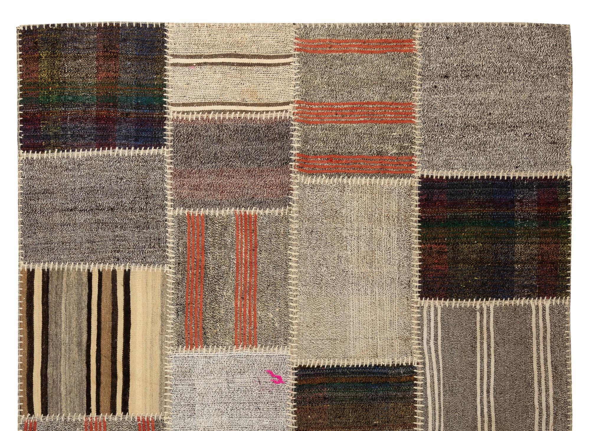 This floor covering is made of pieces of assorted vintage handmade Anatolian kilims. Made of wool, goat hair and cotton. There is a durable cotton twill sewn on the back as an underlay and for a smooth finishing. Measures: 5.9 x 8.4 ft.
    
