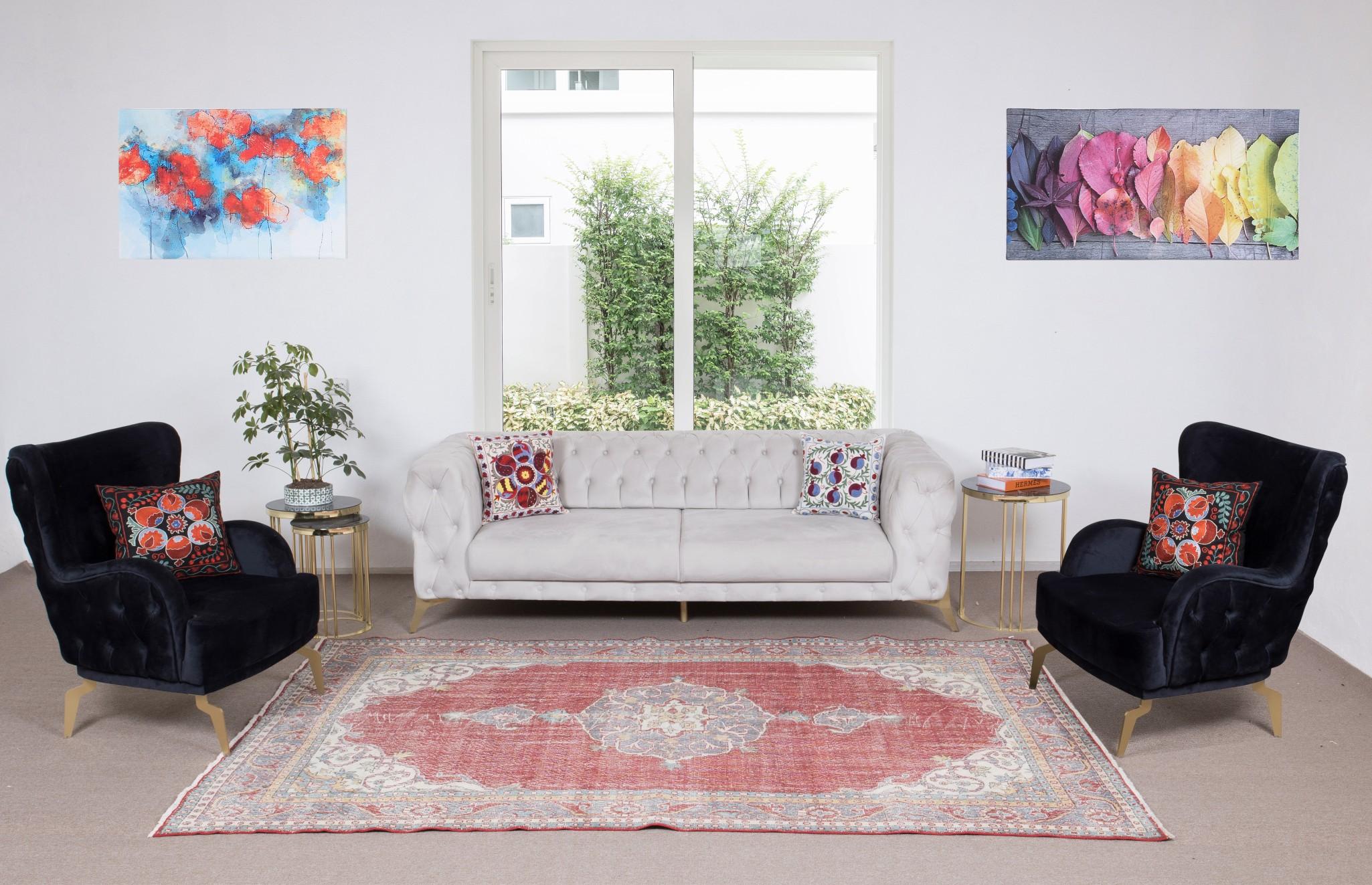 A finely hand-knotted vintage Turkish carpet from 1960s featuring an elegant medallion design. The rug has even low wool pile on cotton foundation. It is heavy and lays flat on the floor, in very good condition with no issues. It has been washed