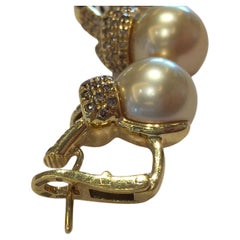Mikimoto, boucles d'oreilles en or jaune 18 carats et diamants avec perles des mers du Sud de 5+A