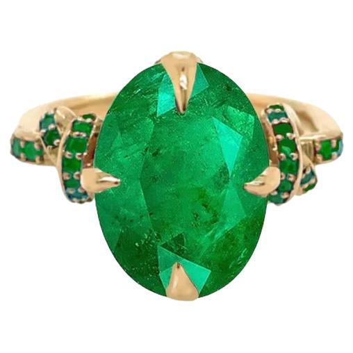 4.01ct Emerald Oval Cut Forget Me Knot Ring in 18Carat Yellow Gold with Emeralds For Sale