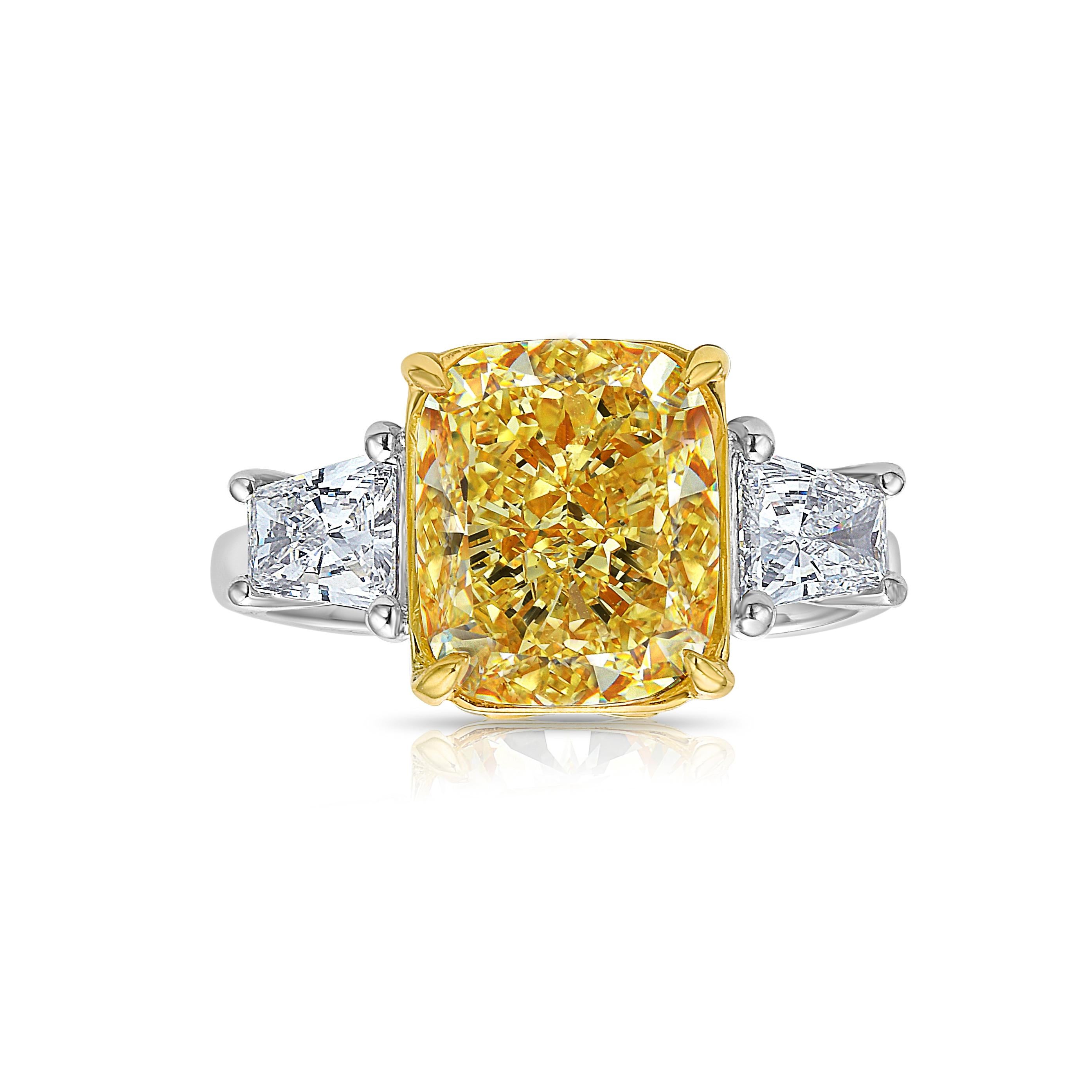 4.84 Carat Fancy Yellow
Cushion Cut Center Diamond
VS2 Clarity
0.72 Carats of Side Trapezoids
GIA Certified Diamond
Crafted in Platinum & 18k Yellow Gold
Handmade in NYC

This piece can be viewed before purchase in our showroom in NYC, or at one of