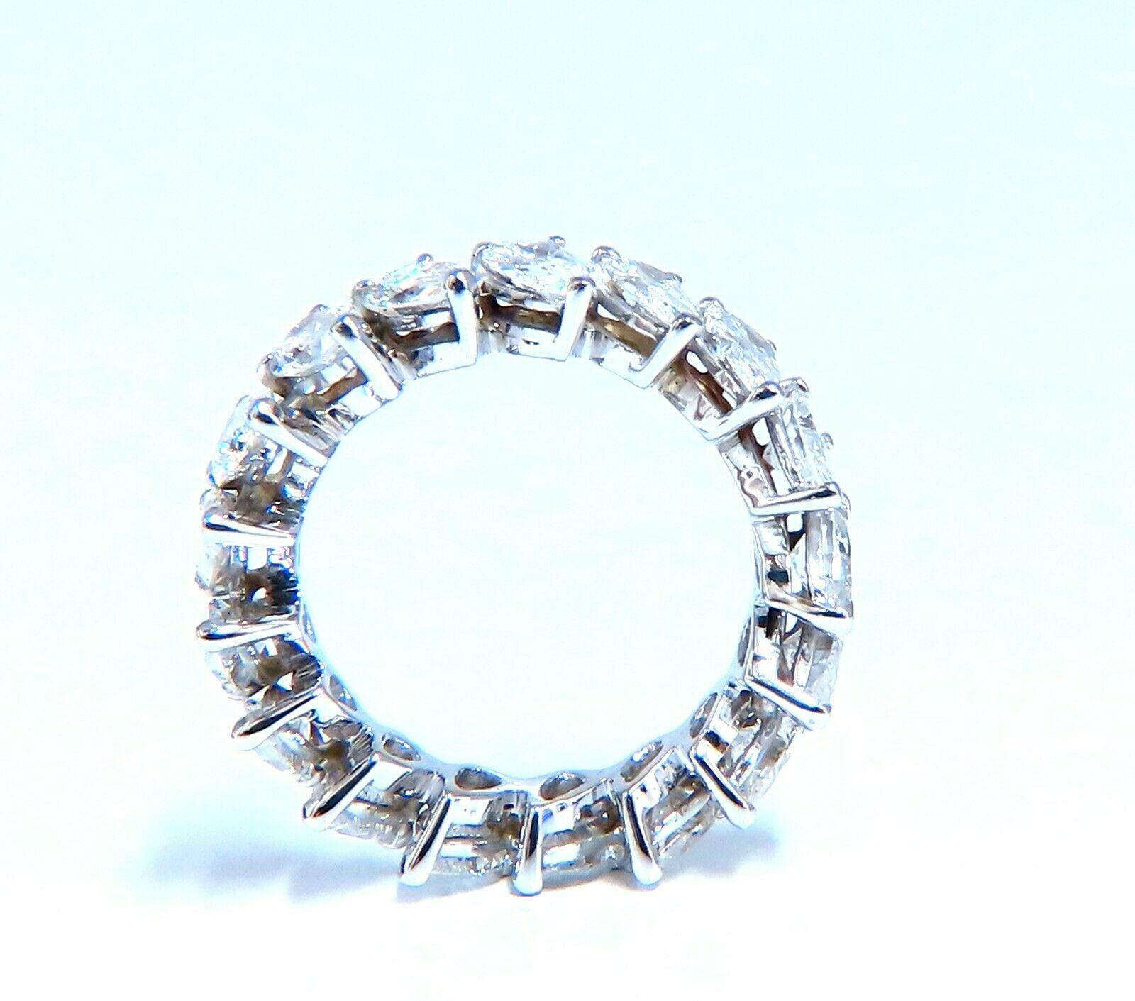 5ct. Natural Diamonds eternity band 
Pear, Brilliant Cuts

G color 

Vs-2 clarity


Raised Prong Set

3.9 grams

5.2mm wide 

3.5mm depth

Size 6.25 and may not resize.


14kt white gold
$20,000 Appraisal Certificate to accompany