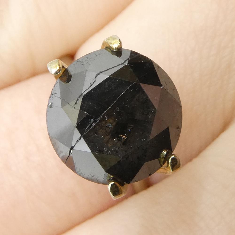 Description:

Gem Type: Diamond 
Number of Stones: 1
Weight: 5 cts
Measurements: 10.38 x 10.38 x 6.78 mm
Shape: Round
Cutting Style Crown: Brilliant Cut
Cutting Style Pavilion: Brilliant Cut 
Transparency: Opaque
Clarity: N/A
Colour: Black
Hue: