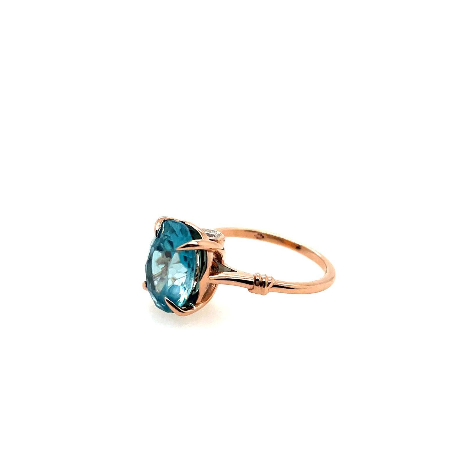 Glamorously bold and unabashedly seductive. This showstopper ring features a glorious claw & set Topaz embraced by small & golden ropes, converging to two knots and round brilliant cut diamonds set on either side of the luscious, one-of-a-kind
