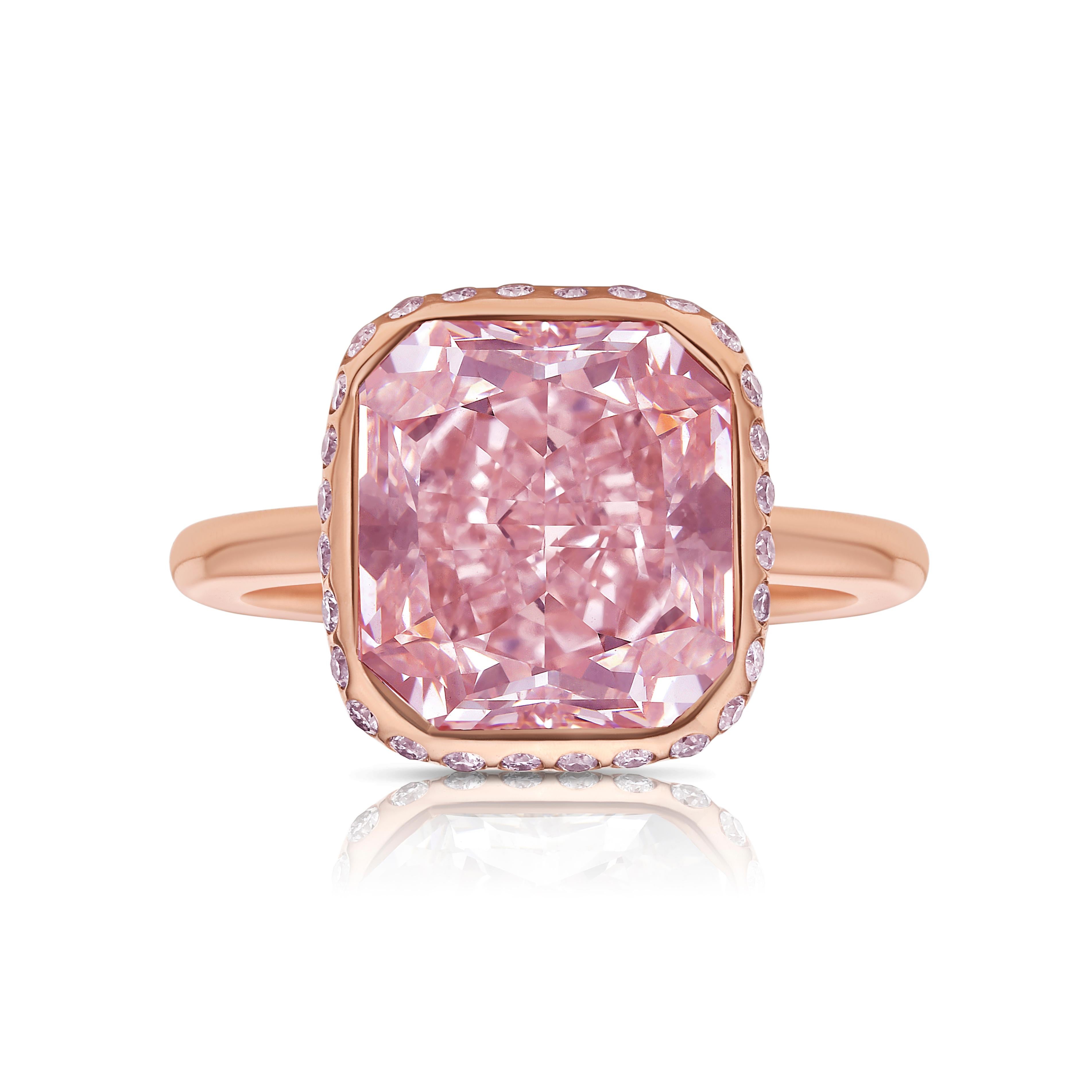 Discover a jewel so extraordinary it transcends time and trends. At the heart of this breathtaking statement ring is a remarkable 5.14-carat very light pink cushion-cut diamond—a treasure of unparalleled rarity and significance. With its natural