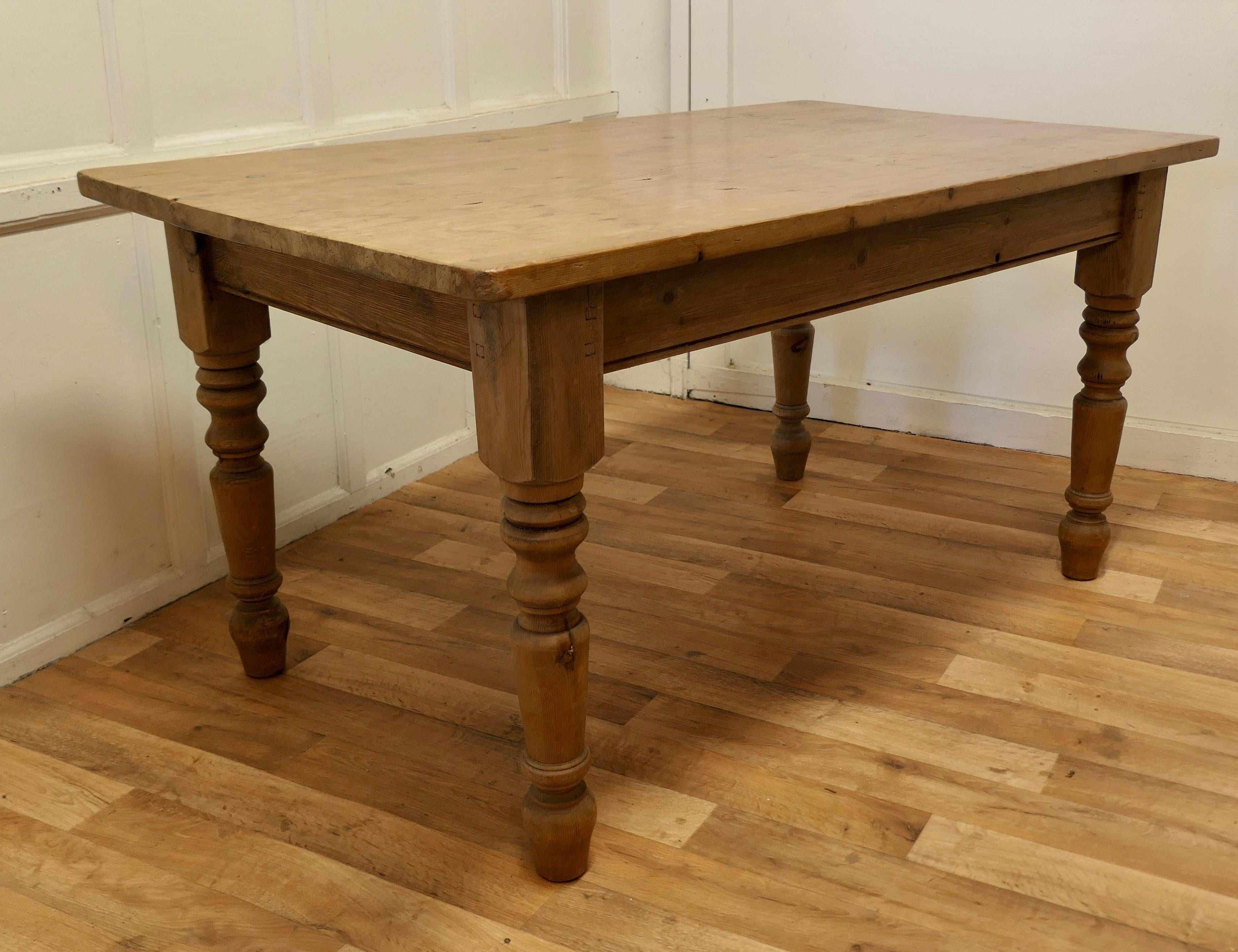 5ft. Long farmhouse pine table 

This is a good Rustic Farmhouse table, it has an old waxed top, the chunky legs are turned
The table though old is very sturdy, it has a few signs of its previous life, it has a rustic appearance, the 1.5” thick