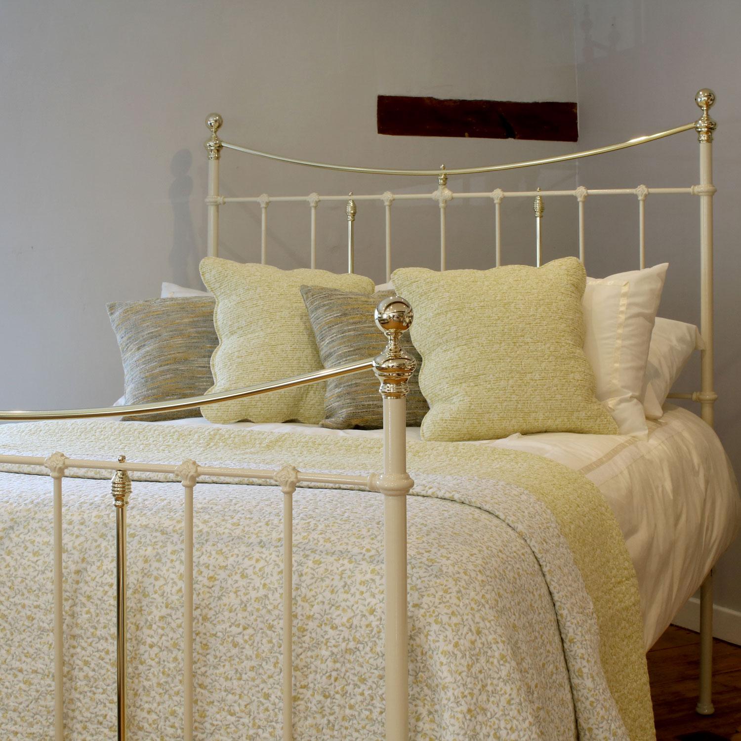Victorian cast iron and brass bedstead in cream with decorative castings and curved brass top rails. 

This bed accepts a UK king size or US queen size (5ft, 60in or 150cm wide) base and mattress set.

The price includes a standard firm bed base