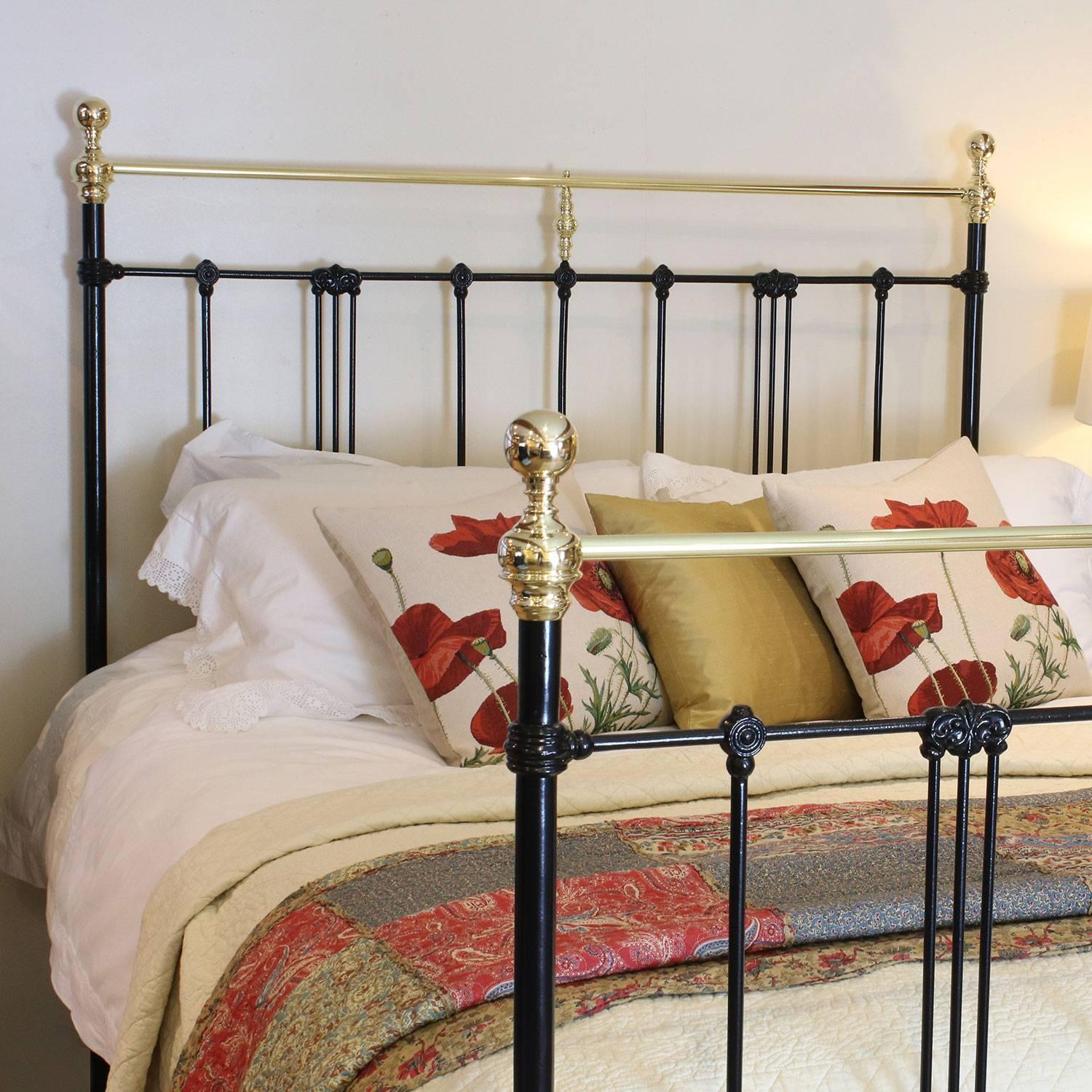 A brass and iron bedstead adapted from an original Victorian frame and finished in black with brass straight top rails and art nouveau style castings.

This bed accepts a British king-size or US queen-size (5ft, 60 inches or 150cm wide) base and