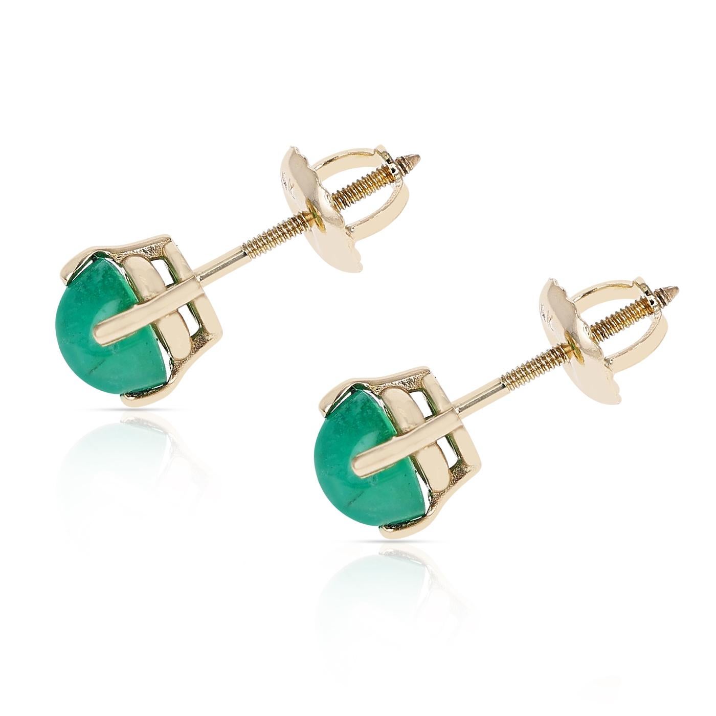 A pair of 5MM Emerald Round Cabochon Stud Earrings made in 14 Karat Yellow Gold. The total stone weight is 1.24 carats.