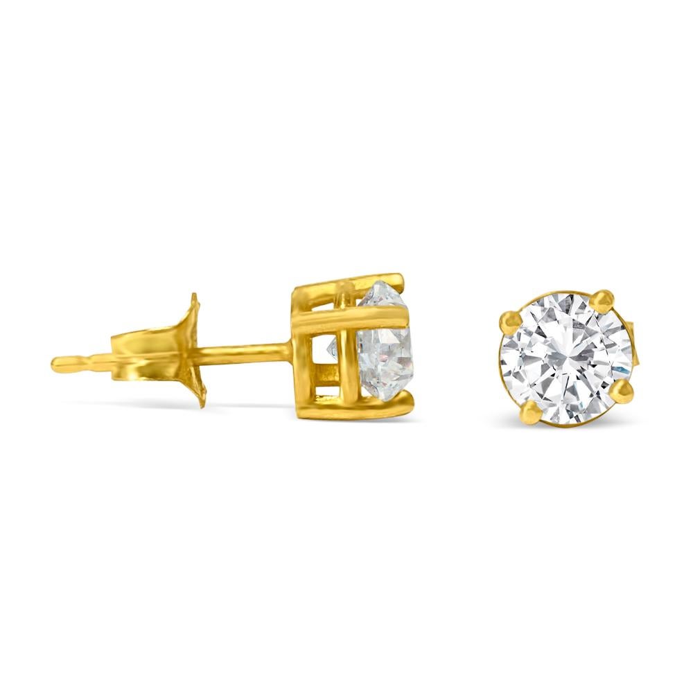 Fashioned from 14k yellow gold, these unisex diamond studs boast 5mm round brilliant cut diamonds totaling 1.00 carat. With VVS-VS clarity and H-I color, the diamonds are set in a classic 4-prong style, highlighting their natural shine and luster.