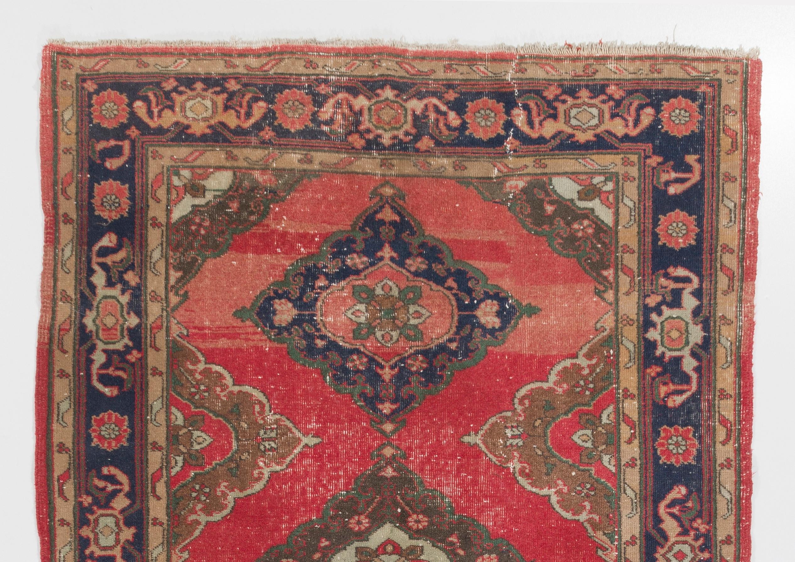 A vintage runner rug from Turkey. It is made of medium wool pile on wool foundation and features multiple medallion design. It has been washed professionally, the rug is sturdy and can be used in both residential or commercial interiors. 
Size: 5 x