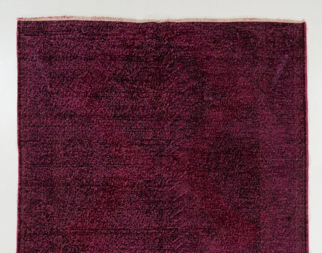 A vintage Turkish runner rug over-dyed in maroon color for contemporary interiors.
Finely hand-knotted, with low wool pile on cotton foundation. Professionally washed.
Sturdy and can be used in a high traffic area, suitable for both residential and