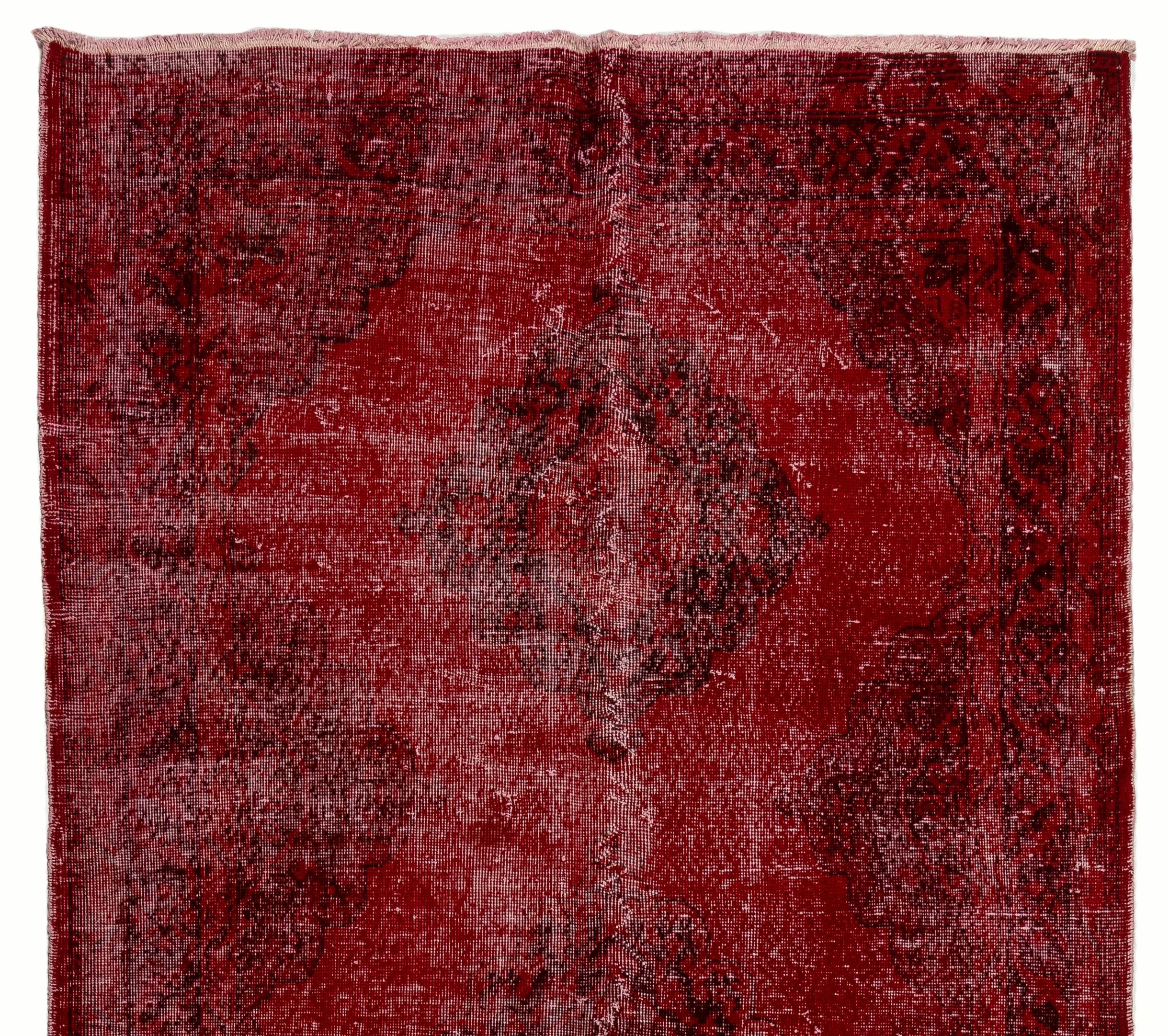 A vintage distressed Turkish runner rug re-dyed in red color, great for contemporary interiors.
Finely hand knotted, low wool pile on cotton foundation. Professionally washed.
Sturdy and can be used on a high traffic area, suitable for both