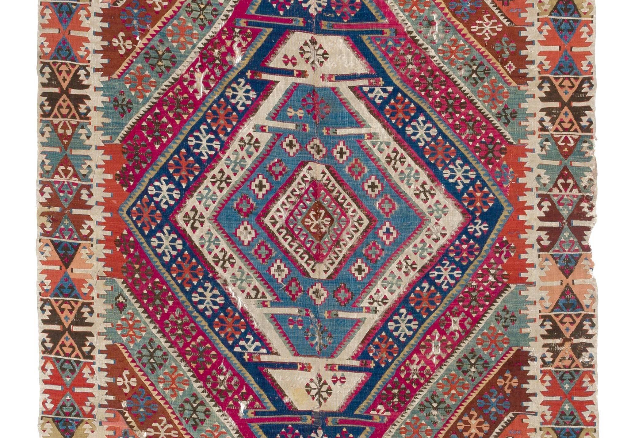 A splendid antique Kilim (flat-woven rug) from East Anatolia. Traditionally the rug is finely hand-woven in two panels and connected in the center, it is made of wool and the colors are all sourced from natural vegetal dyes. Measures: 5 x 13.5 Ft.