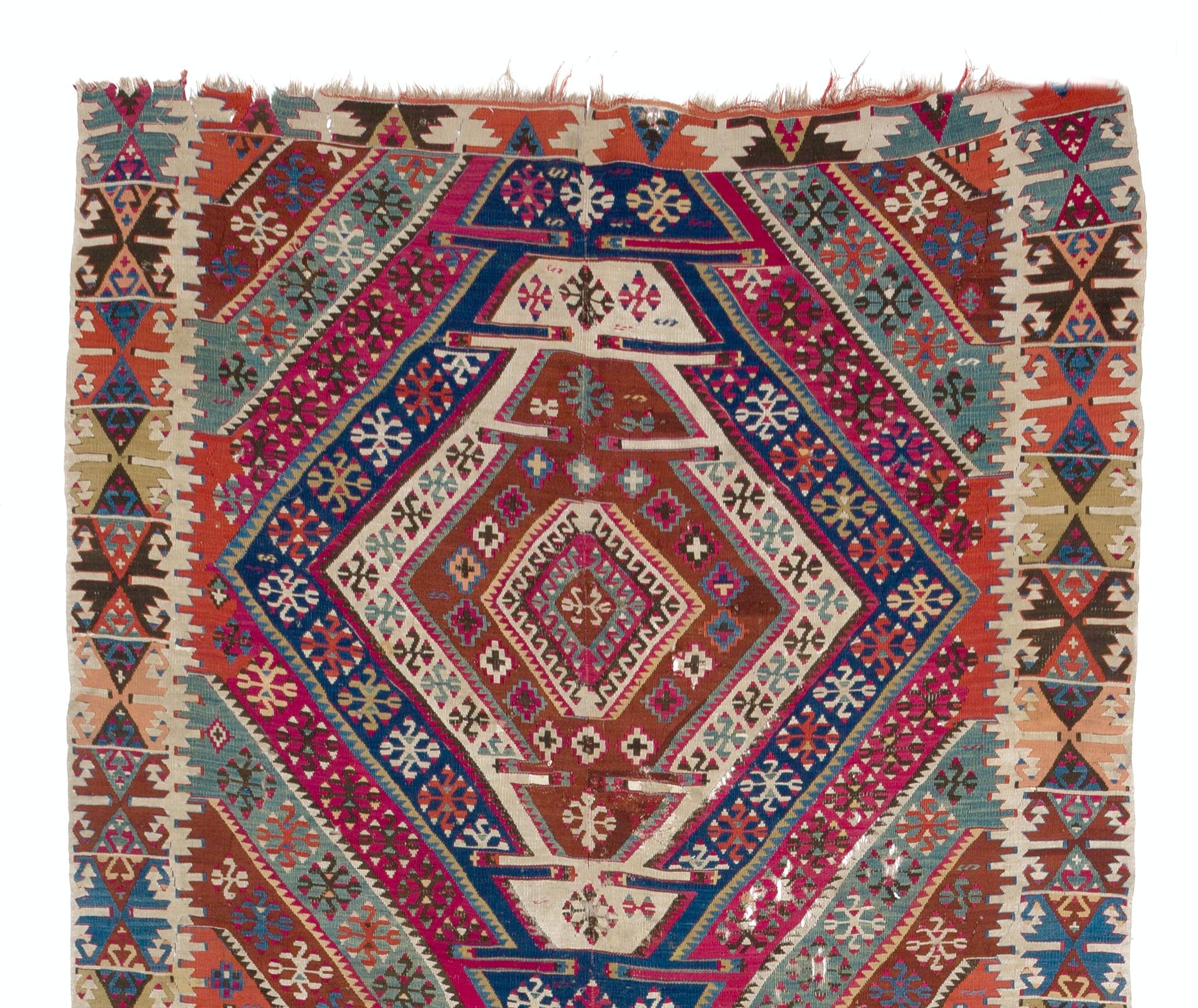A splendid antique Kilim (flat-woven rug) from East Anatolia. Traditionally the rug is finely hand-woven in two panels and connected in the center, it is made of wool and the colors are all sourced from natural vegetal dyes. Measures: 5 x 13.5 Ft.