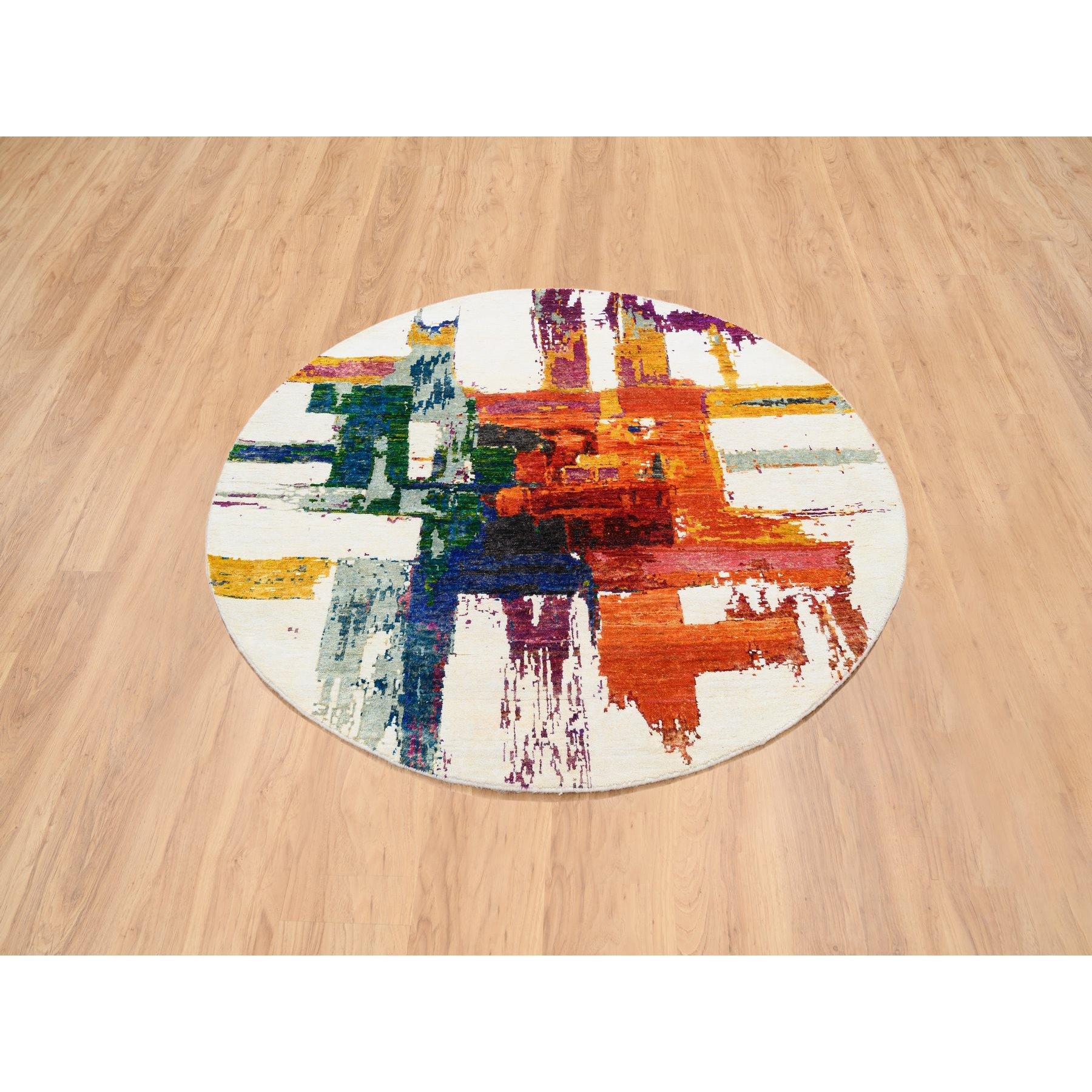This is a truly genuine one-of-a-kind Colorful, Modern Abstract Motifs with Painter's Brush Strokes, Wool and Sari Silk Hand Knotted, Round Oriental Rug. It has been Knotted for months and months in the centuries-old weaving craftsmanship techniques