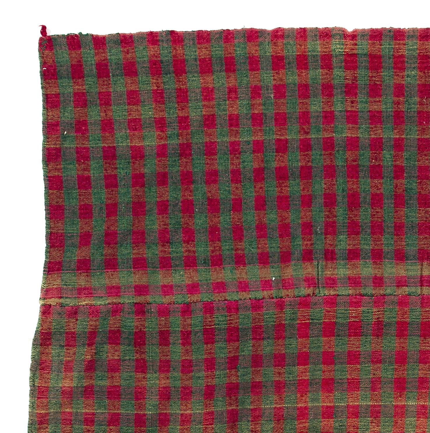Vintage checkered Turkish flat-weave Kilim rug in red and green color. Measures: 4.4 x 5 ft.

This beautiful and simple weaving is sturdy and clean, it can be used on the floor as a rug or as a bed cover, sofa throw or wall hanging. It is soft and