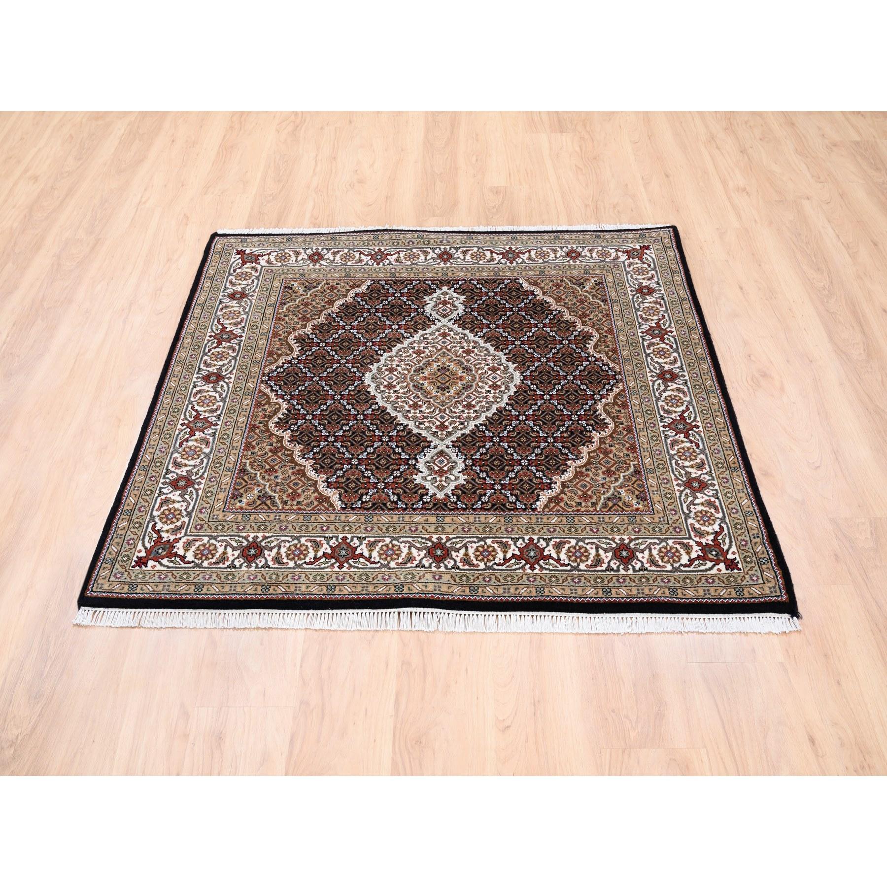 This is a truly genuine one-of-a-kind Hand Knotted Black Wool Fish Medallion Design Tabriz Mahi Oriental Square Rug. It has been Knotted for months and months in the centuries-old Persian weaving craftsmanship techniques by expert artisans.
Primary