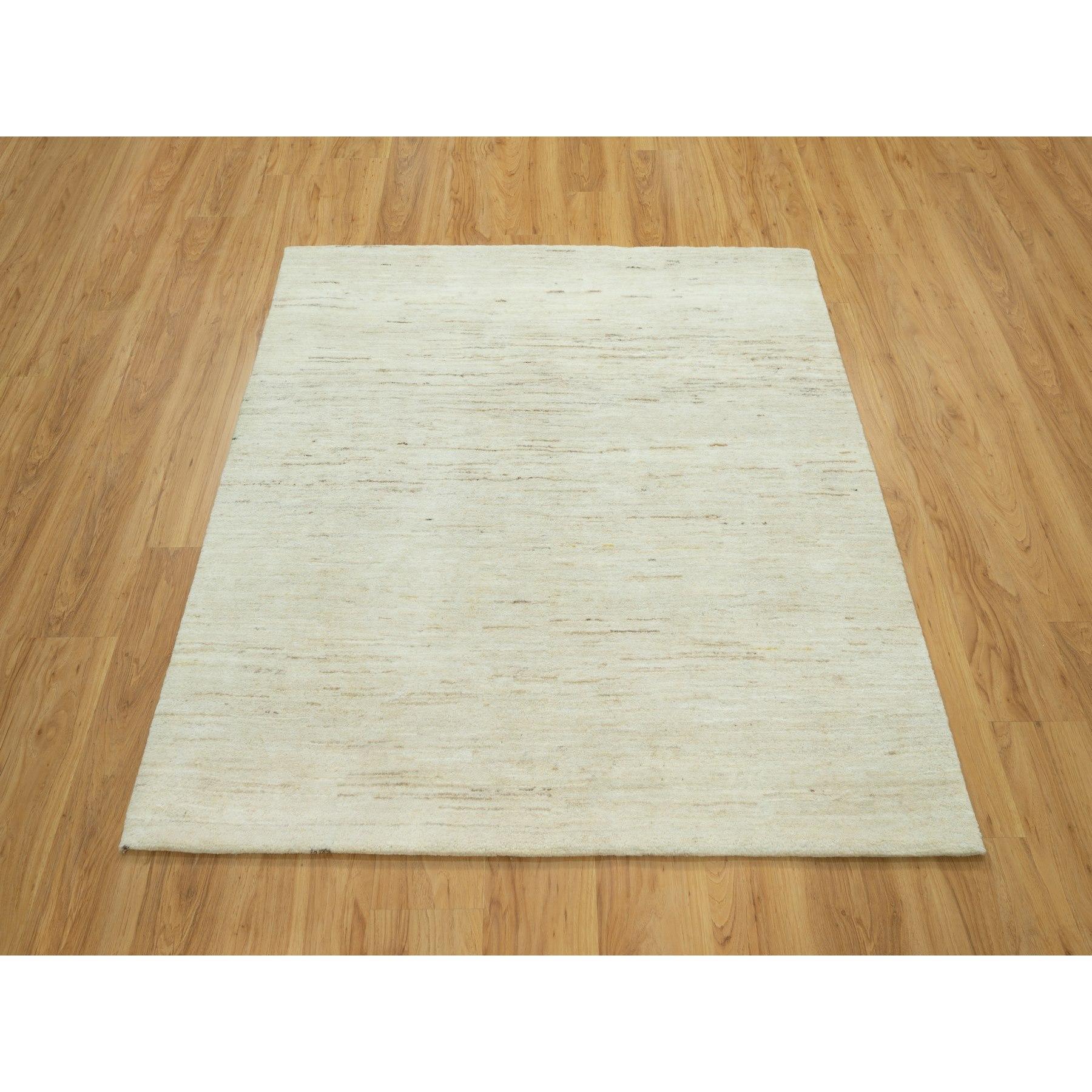 Magnolia White, Lori Buft Gabbeh Plain Design, Thick and Plush, Pure Persian Wool, Soft to The Touch, Hand Knotted, Square Oriental Rug
Primary materials: Wool
Latex: No Pile 
height: 0.25 Inches
Style: Transitional
Primary color: Ivory
Secondary