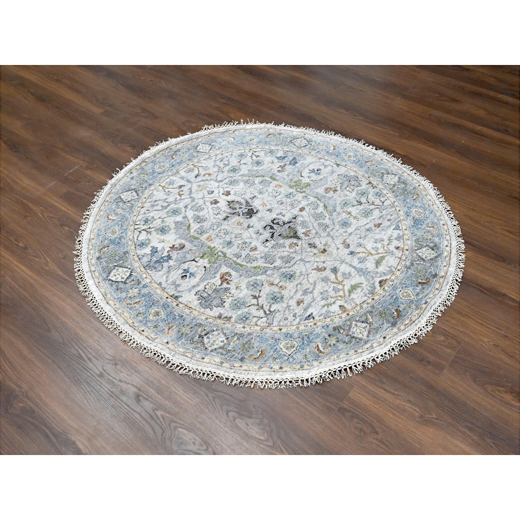 This is a truly genuine one-of-a-kind Denser Weave Oushak with Floral Motifs, 100% Wool Hand Knotted, Round Oriental Rug. It has been Knotted for months and months in the centuries-old weaving craftsmanship techniques by expert artisans.
Primary