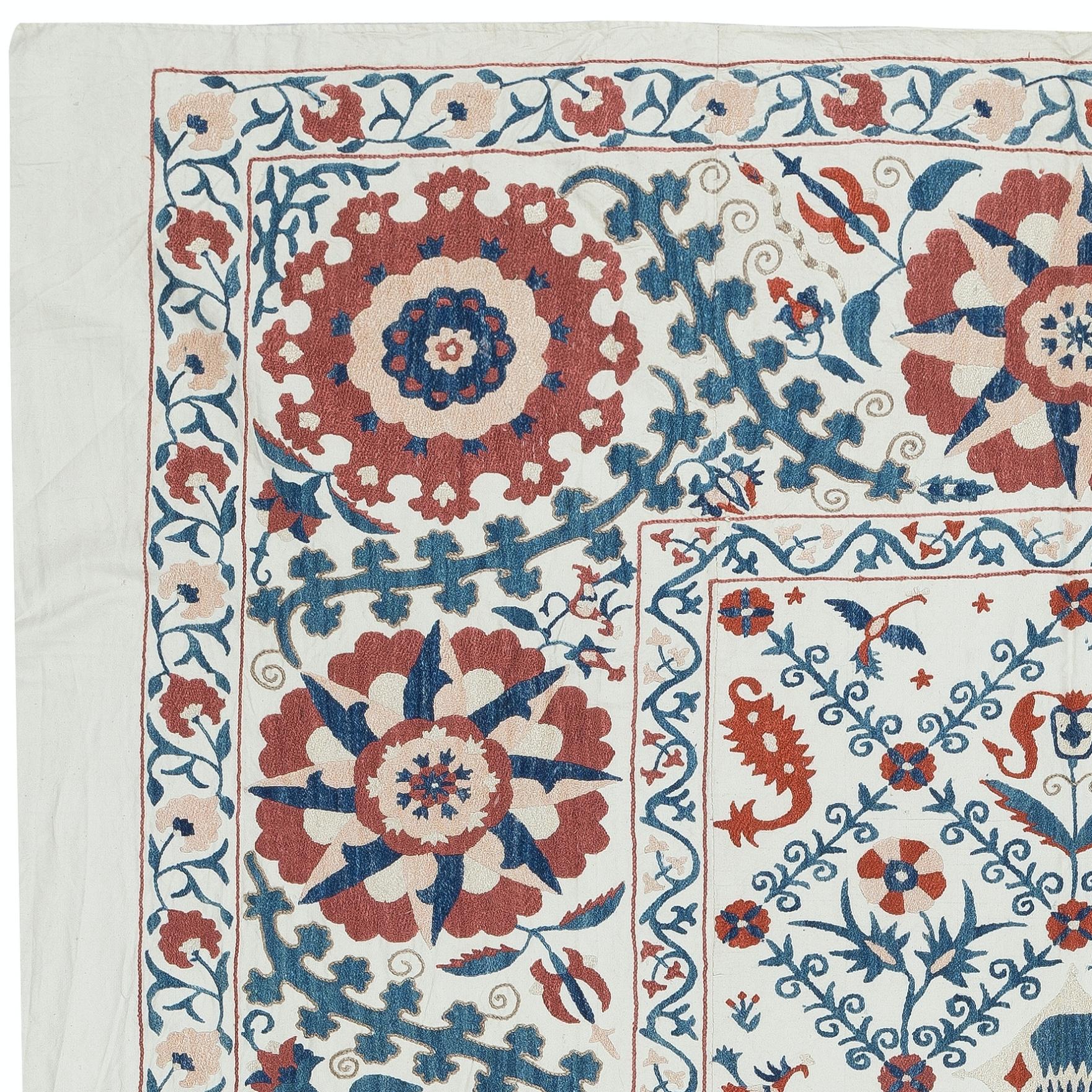 Introducing our exquisite new suzani hand embroidered wall hanging, a captivating piece that combines ancient craftsmanship with modern artistry. This embroidered cloth is not just a suzani throw, but a remarkable suzani wall hanging that will