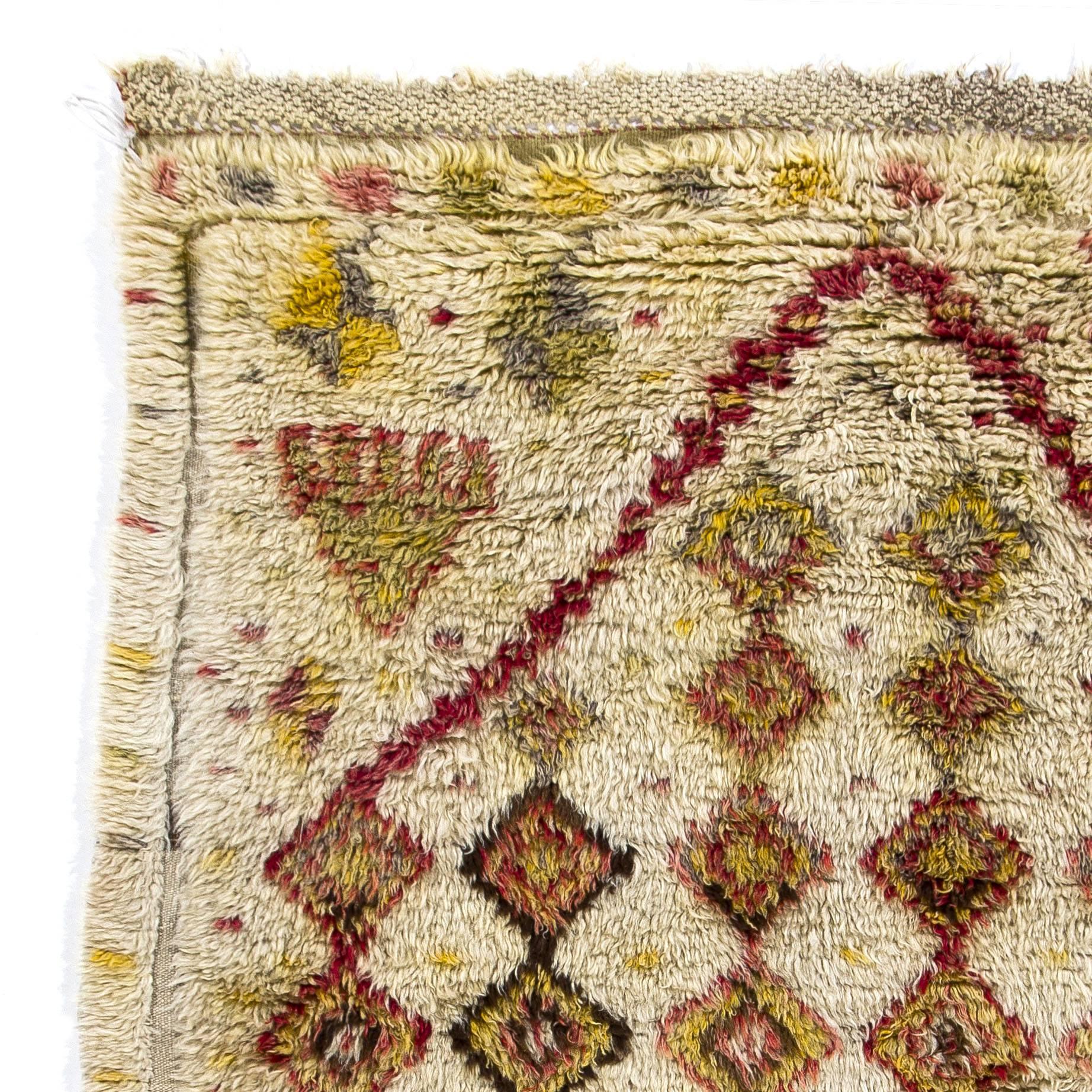 A one-of-a-kind early 20th century, Tulu, (thick-pile) rug from central Turkey with a niched design of linked and colorful lozenges 100% wool.

These rare small rugs were made for daily use by nomads and villagers in Konya region of Central