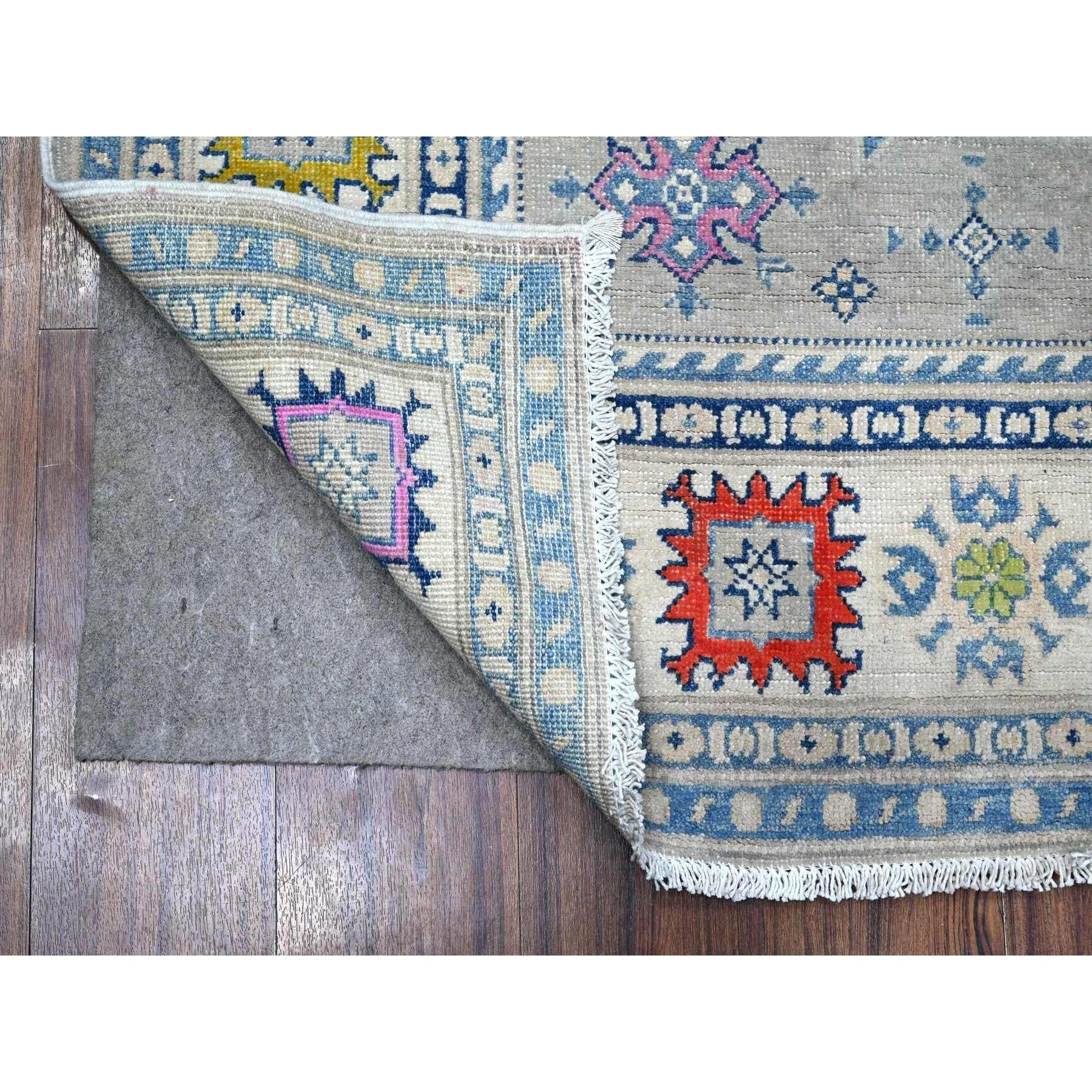 This is a truly genuine one-of-a-kind Fusion Kazak, Hand Knotted, Pure Wool, Oriental Rug. It has been Knotted for months and months in the centuries-old weaving craftsmanship techniques by expert artisans.
Primary materials: Wool
Latex: No Pile