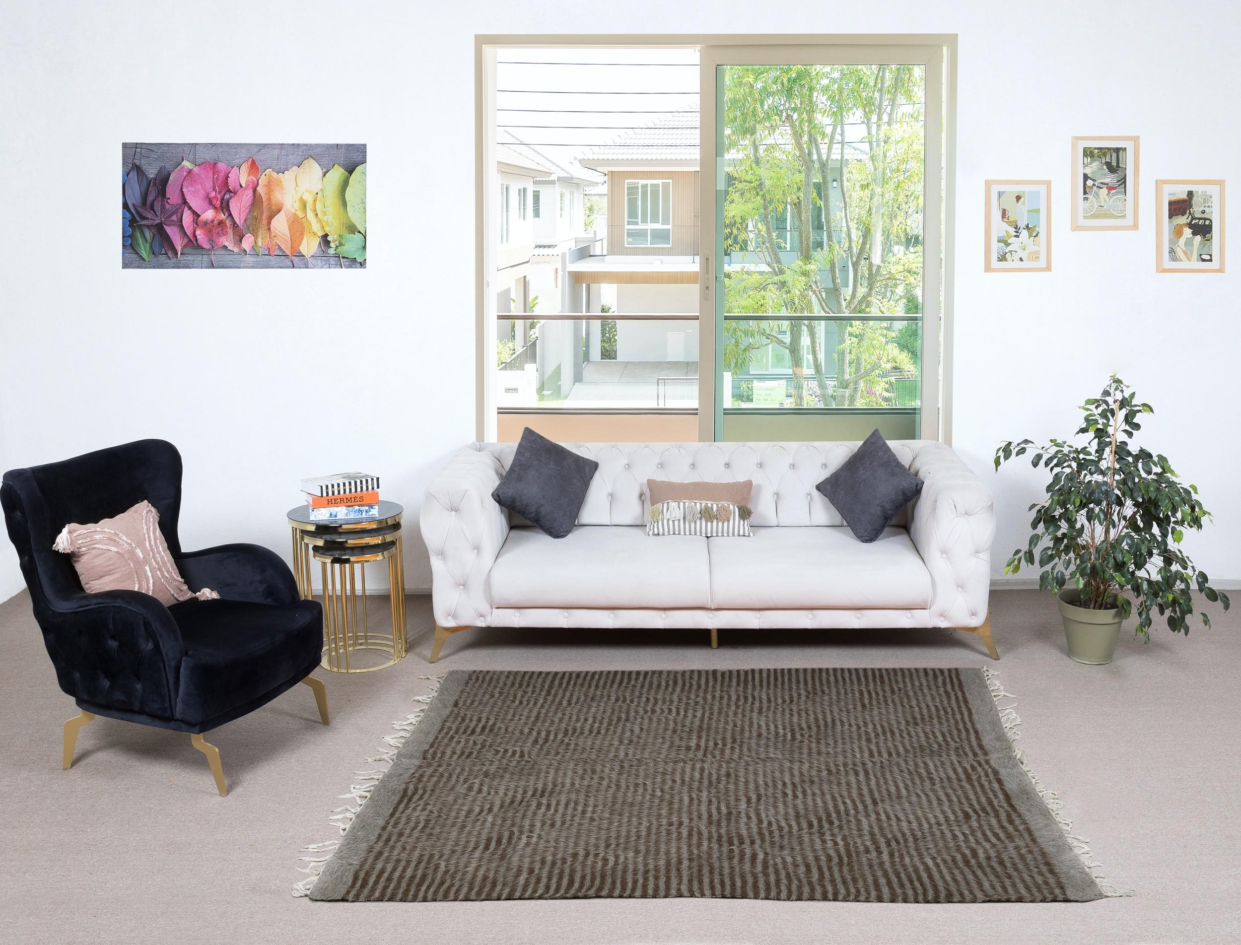 Decorative flat-weave Kurdish rug made of goat's wool, New production. Very Soft, floppy weave, ideal to use on the floor with a rug-pad or as a table cover, bed cover, wall hanging, sofa throw or blanket.

Size: 5 x 6.7 Ft (155 x 203 cm)
Age: