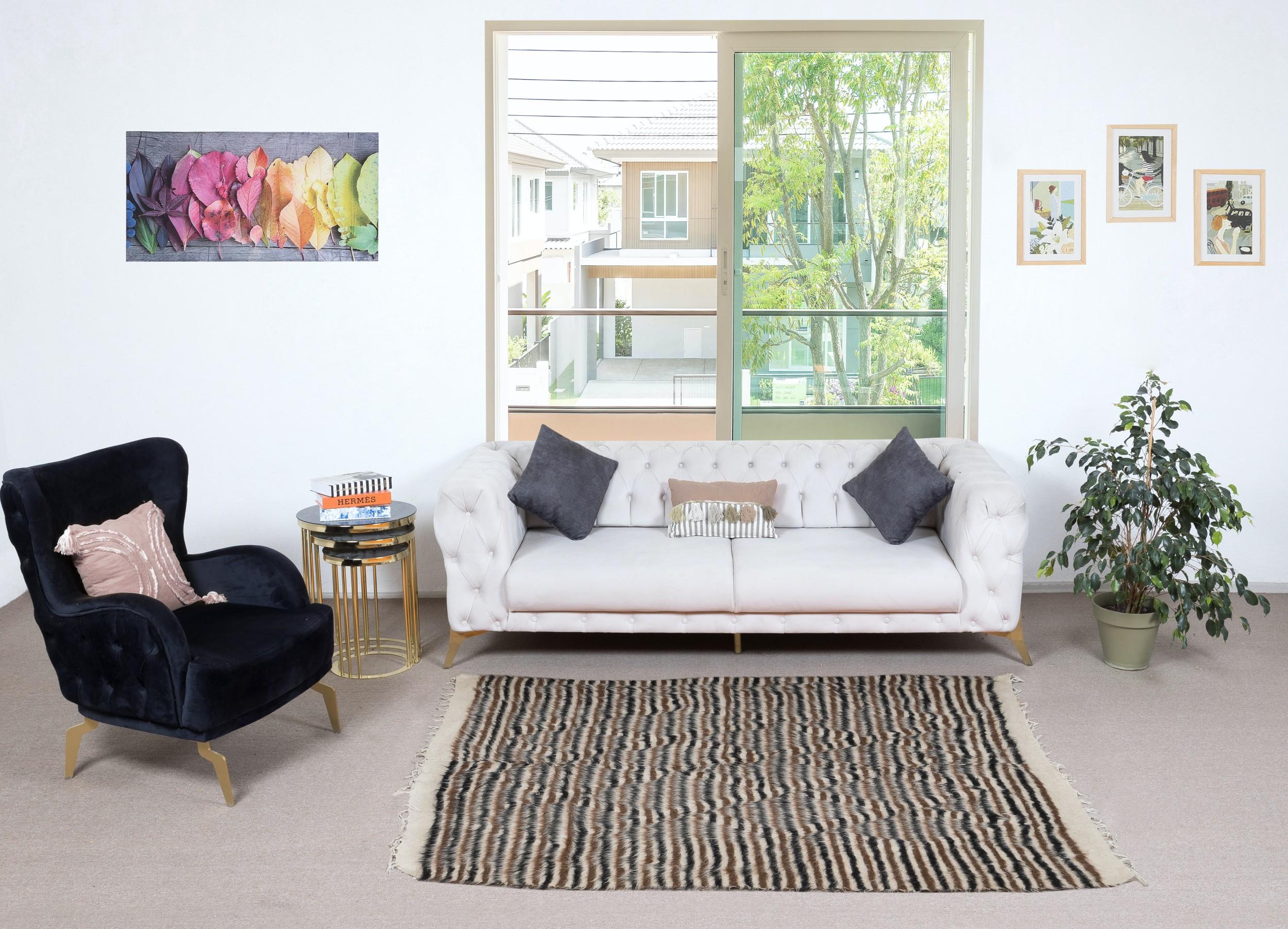 Decorative flat-weave Kurdish rug made of goat's wool, New production. Very Soft, floppy weave, ideal to use on the floor with a rug-pad or as a table cover, bed cover, wall hanging, sofa throw or blanket.

Size: 5 x 6.8 Ft (147 x 207 cm)
Age: