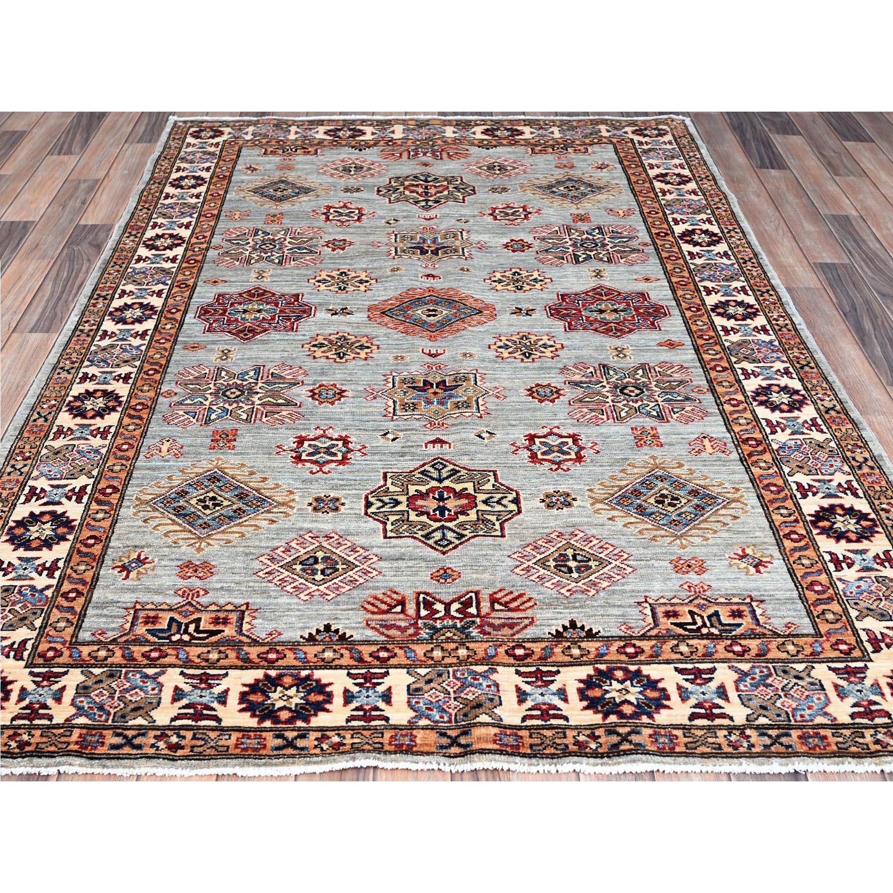 This is a truly genuine one-of-a-kind Afghan Super Kazak, Hand Knotted, Pure Wool, Oriental Rug. It has been Knotted for months and months in the centuries-old weaving craftsmanship techniques by expert artisans.
Primary materials: Wool
Latex: No