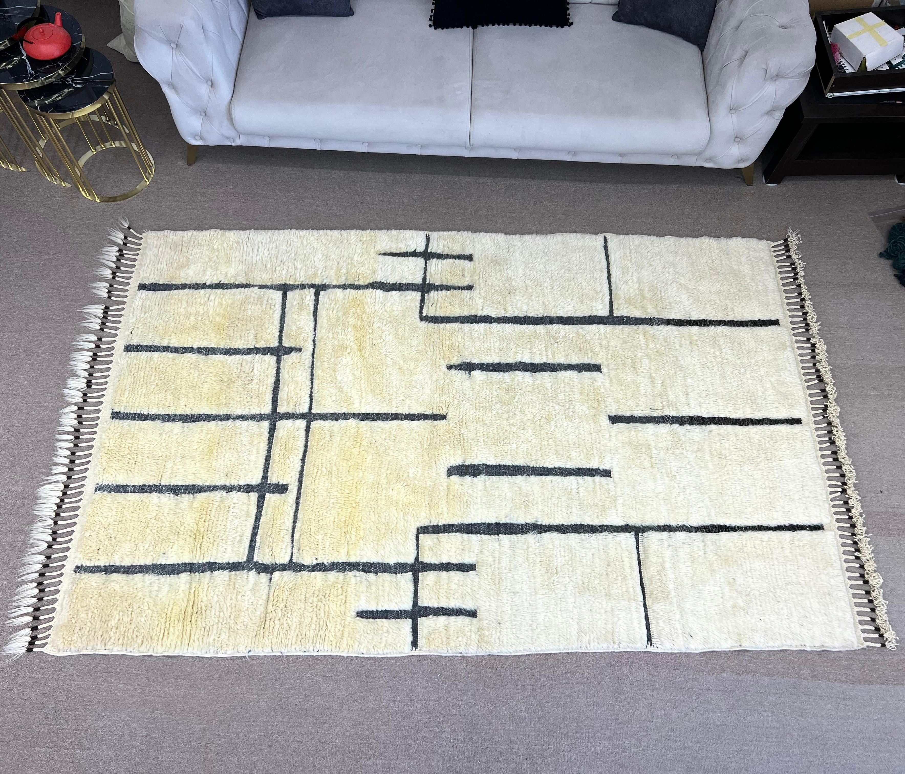 Elevate your living space with the exquisite charm of this new modern hand-knotted Moroccan berber beni ourain rug, crafted with precision and care from 100% wool. Combining the allure of Moroccan design with contemporary sensibilities, this rug is