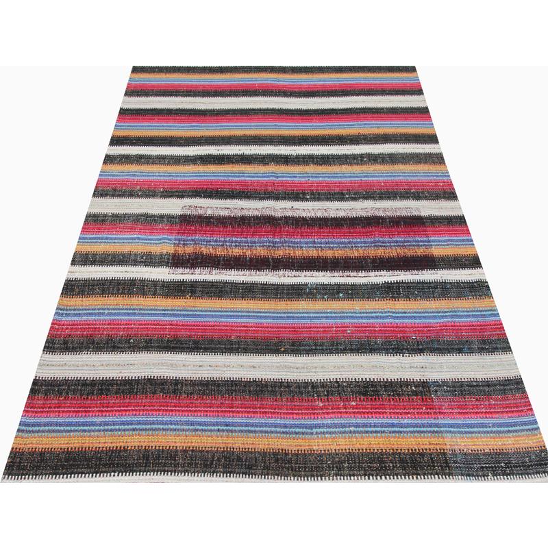 Flat-weave Persian Kilim rug, this fun rug is a beautiful flat-weave Persian Kilim rug featuring a vibrant alternating multicolored stripes design. The lightweight construction makes this rug an excellent choice for a day at the beach or even an