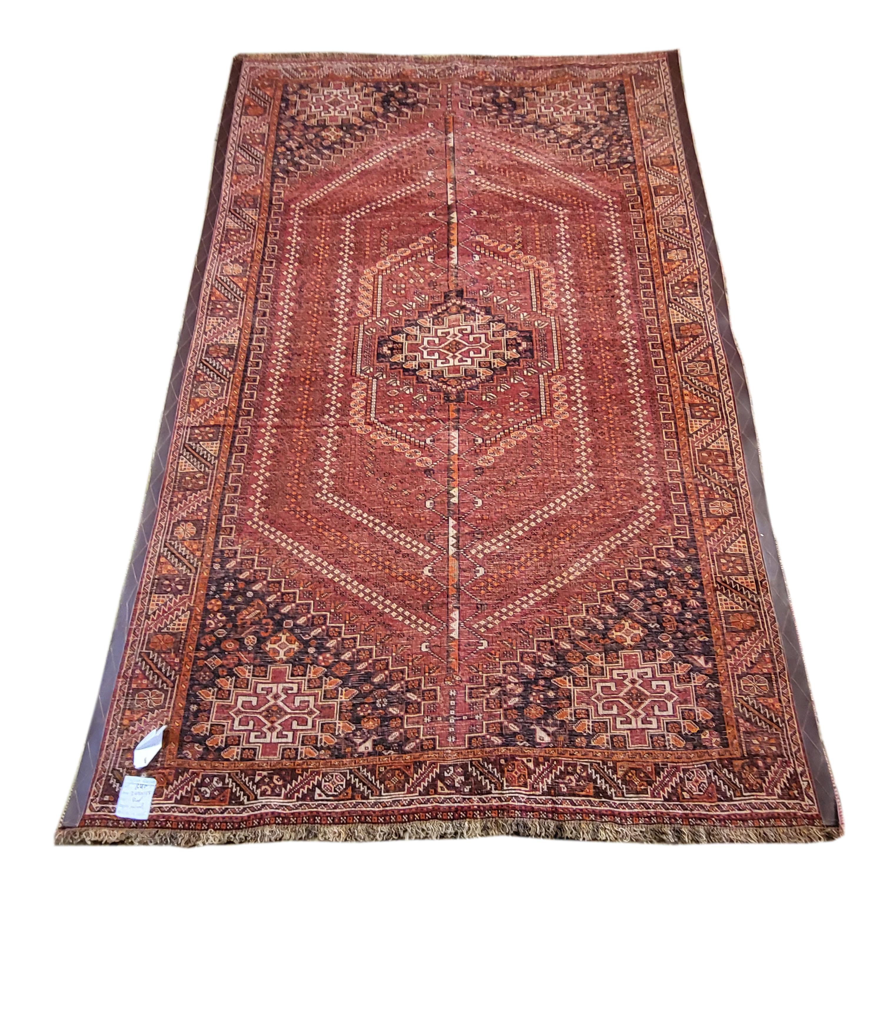 Immaculate vintage Qashqai- Rahimi. This stunning rug is one of a kind and in perfect condition. The incredibly intricate design is enhanced with the rich color selection, and the shine of the incredibly fine wool. The Rahimis are a sub tribe of