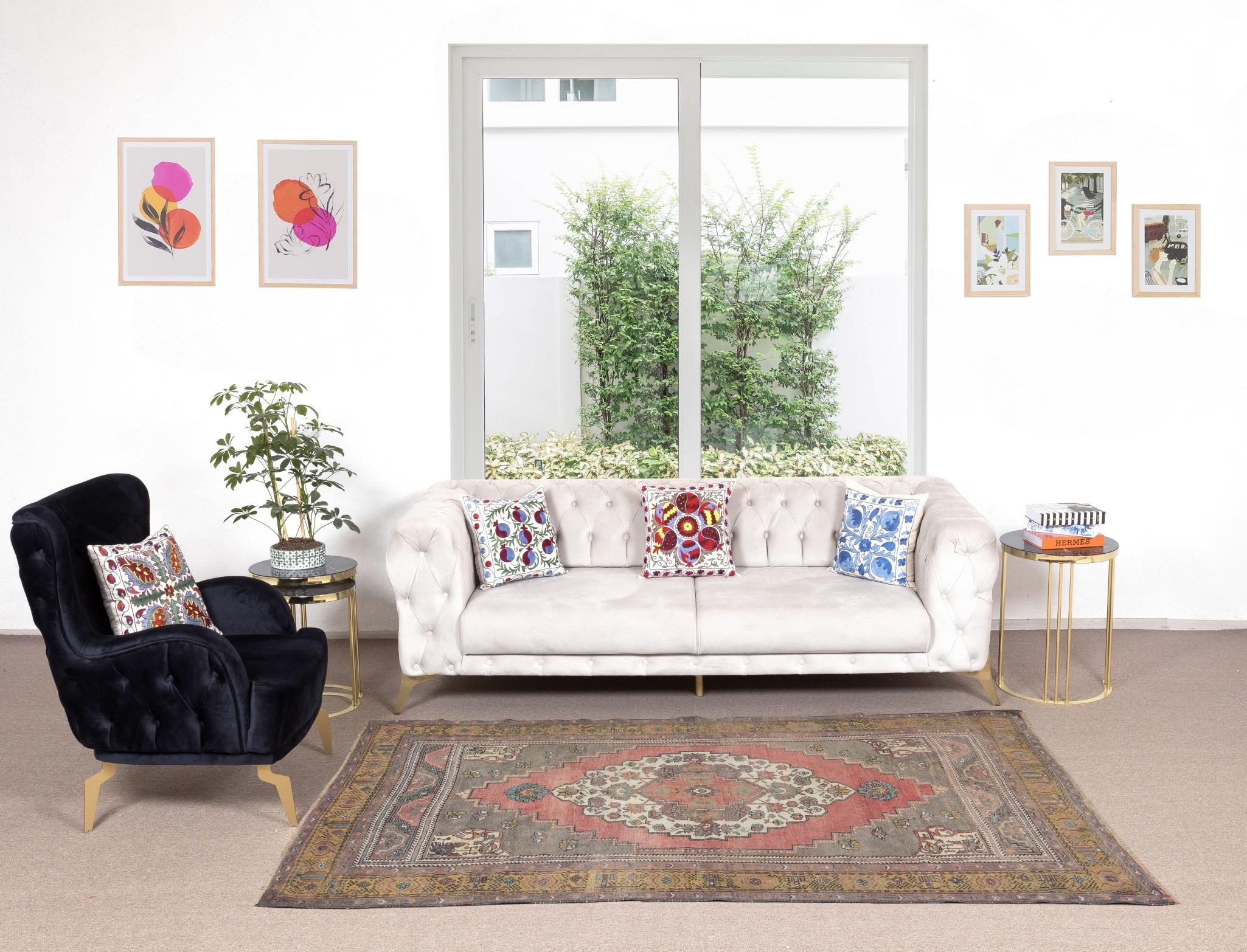 A finely hand-knotted vintage Turkish carpet from 1960s featuring a well-drawn geometric design with a medallion at its center. The rug is made of medium wool pile on wool foundation. It is heavy and lays flat on the floor, in very good condition