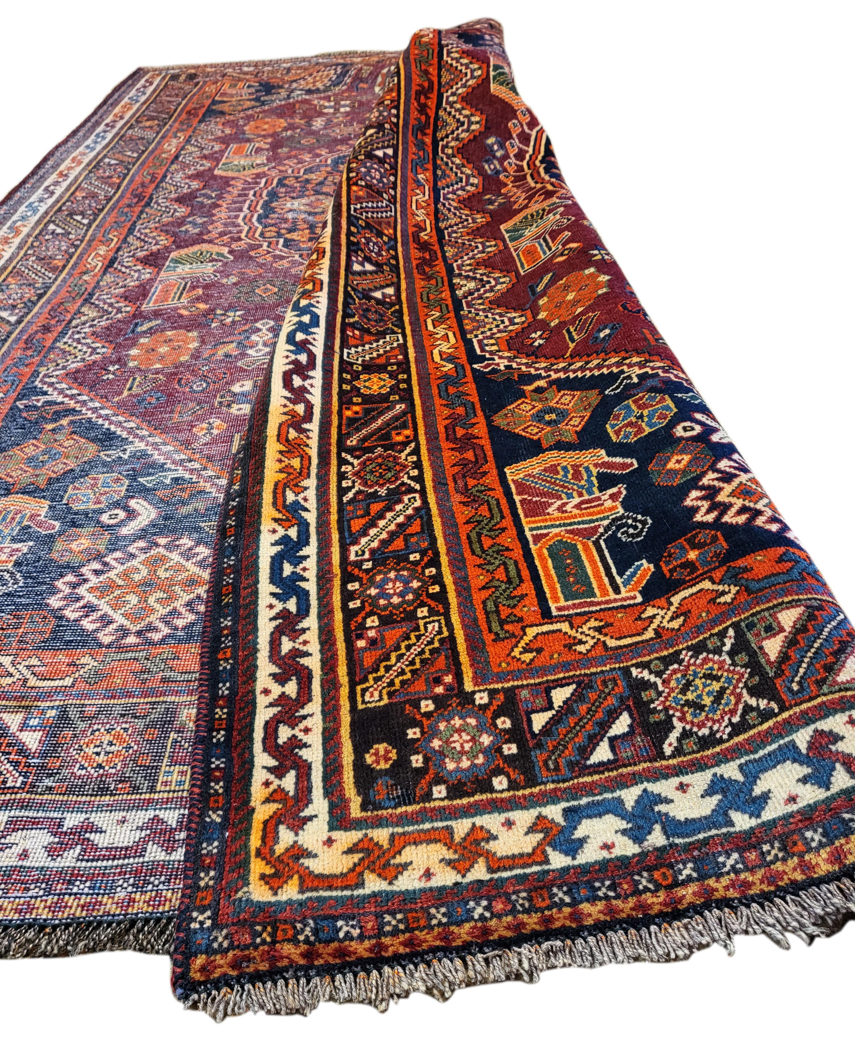 Incredible 60's Persian Qashqai. This breath taking 100% wool rug is a nomadic masterpiece. This piece was masterfully woven by a sub-tribe of the Qashqai's known as The Shiraholi's, known for their striking colors and intricate design. This rug is