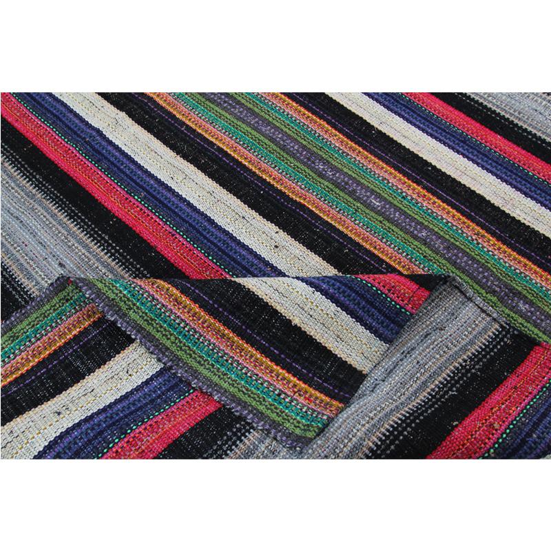 Description
Flatweave Persian Kilim Rug – This fun rug is a beautiful flat weave Persian Kilim rug featuring a vibrant alternating multi-colored stripes design. The lightweight construction makes this rug an excellent choice for a day at the beach