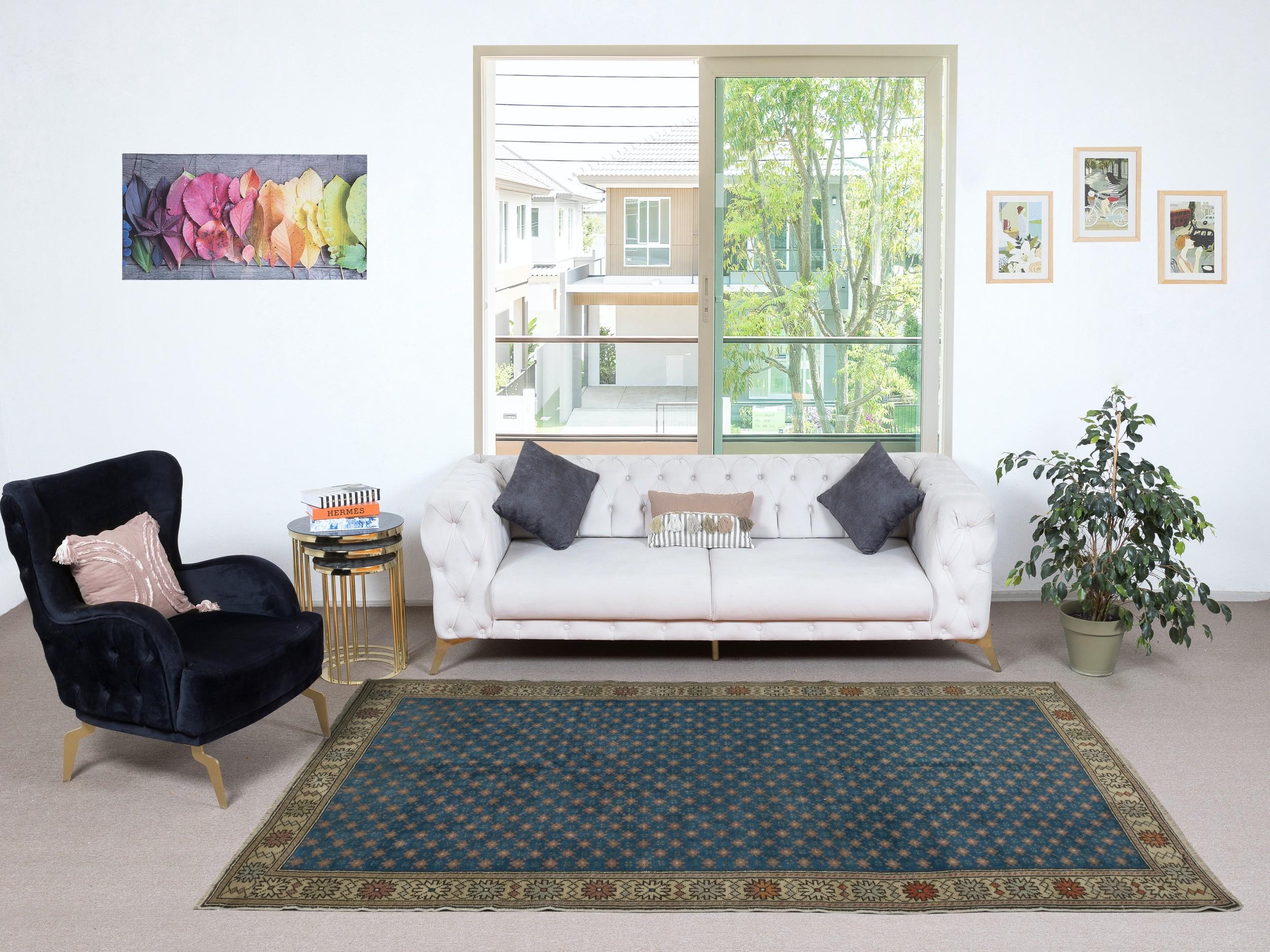 Add a touch of timeless elegance to your home with this traditional vintage hand knotted Turkish area rug, crafted from 100% premium wool. This exquisite piece captures the essence of traditional Anatolian craftsmanship, featuring intricate patterns