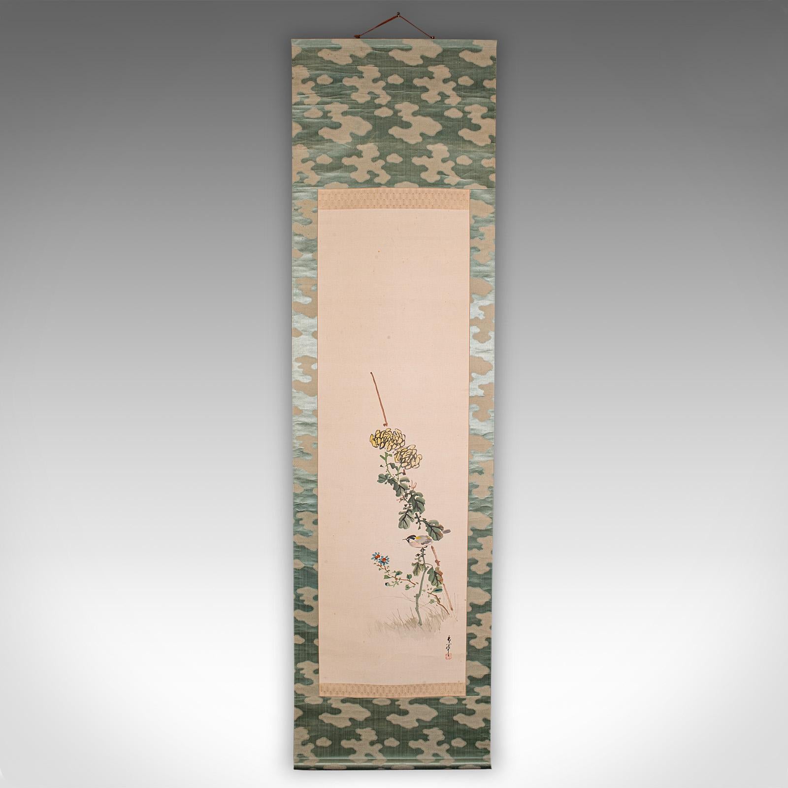 
This is a tall antique scroll painting. A Japanese, silk cotton rolling wall panel, dating to the early 20th century, circa 1920.

Delightful, Japanese wall hanging art with a tasteful scene
Of excellent proportion, at a length of 6' 6''
Displays a