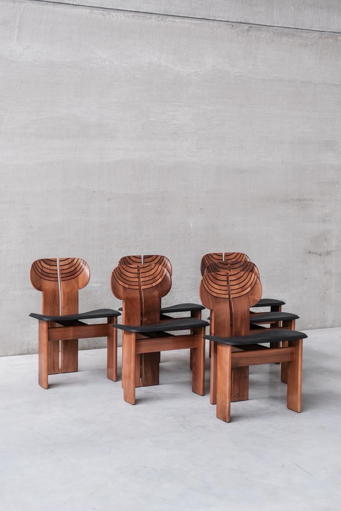 Set of 6 Africa chairs by Afra and Tobia Scarpa for Maxalto that represent the timeless allure of design history. Meticulously brought back to their original splendor, each individual chair showcases the remarkable craftsmanship of Afra and Tobia