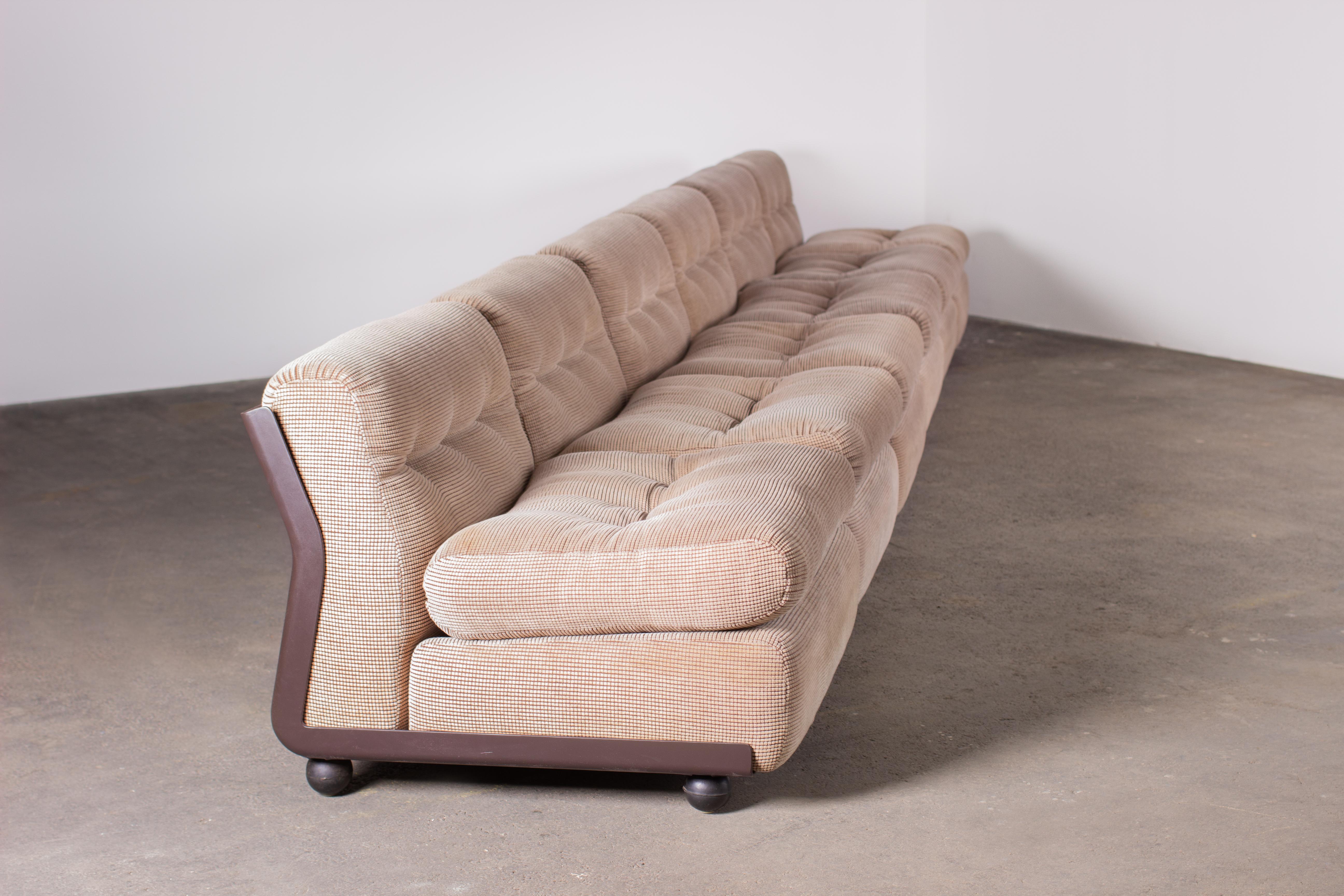 Set of 6 iconic Amanta lounges by Mario Bellini for B&B Italia. Brown fiberglass shell houses seating upholstered in a very particular and attractive original fabric.

Provenance: acquired from a hotel in Northern Italy.