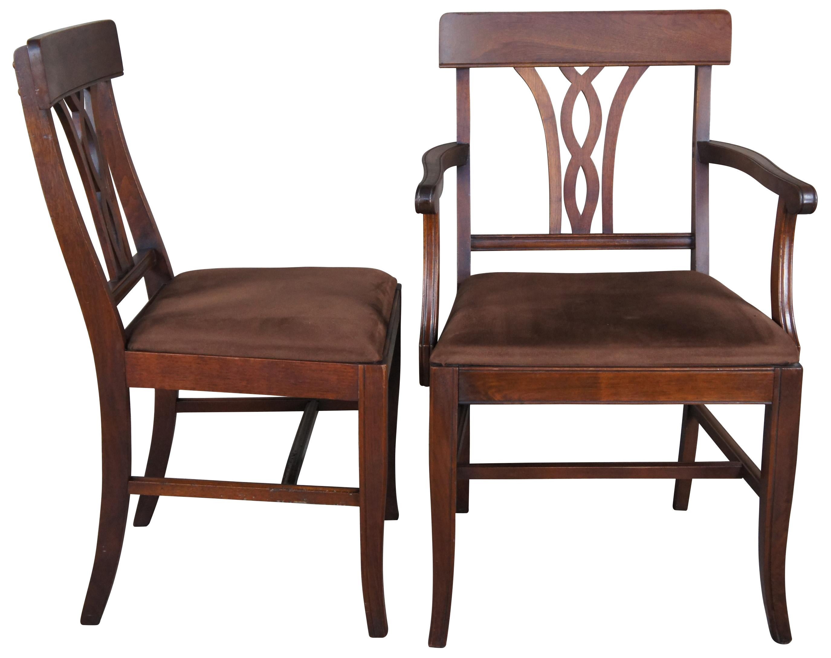 6 early 20th century dining chairs. Made from walnut with a curved crest rail over interlaced back splat and brown suede seat.

Measures: 23