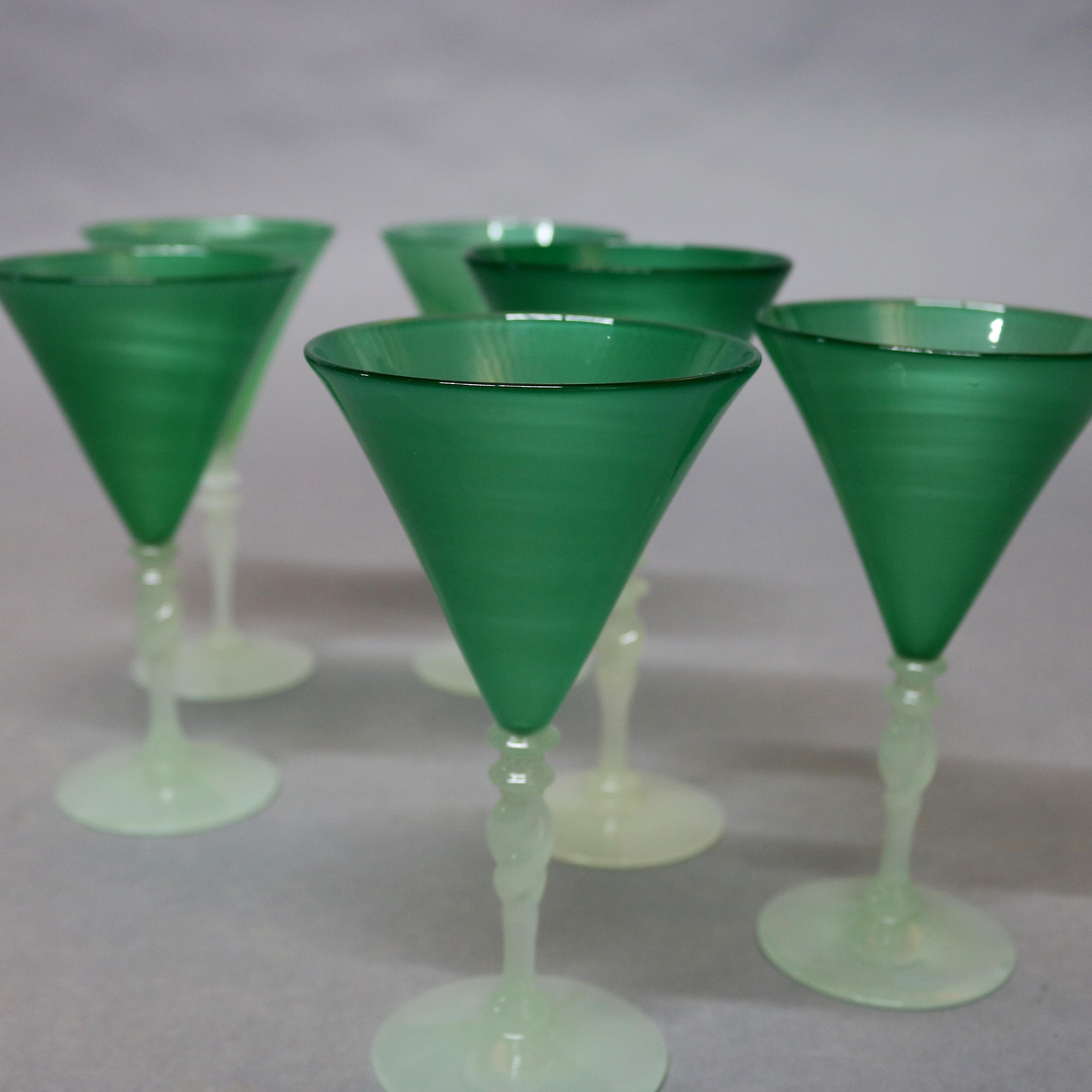 Set of six Steuben art glass stemmed glasses feature conical jade green cups surmounting twisted alabaster stems, carder era wine glasses, circa 1930.

Measures: 7
